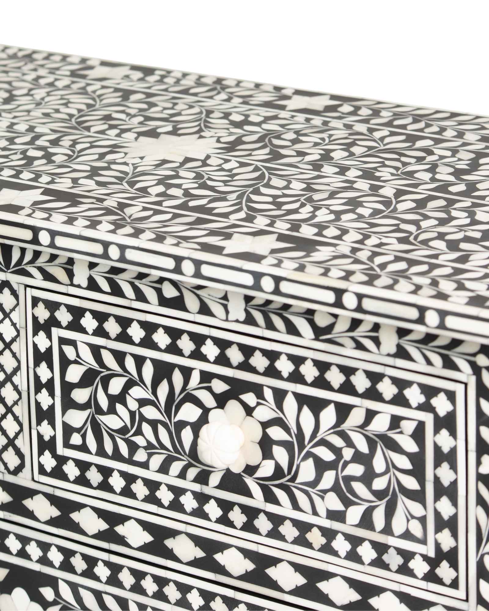 Bone inlay chest of drawers featuring intricate floral pattern in black and white, handcrafted furniture piece.
