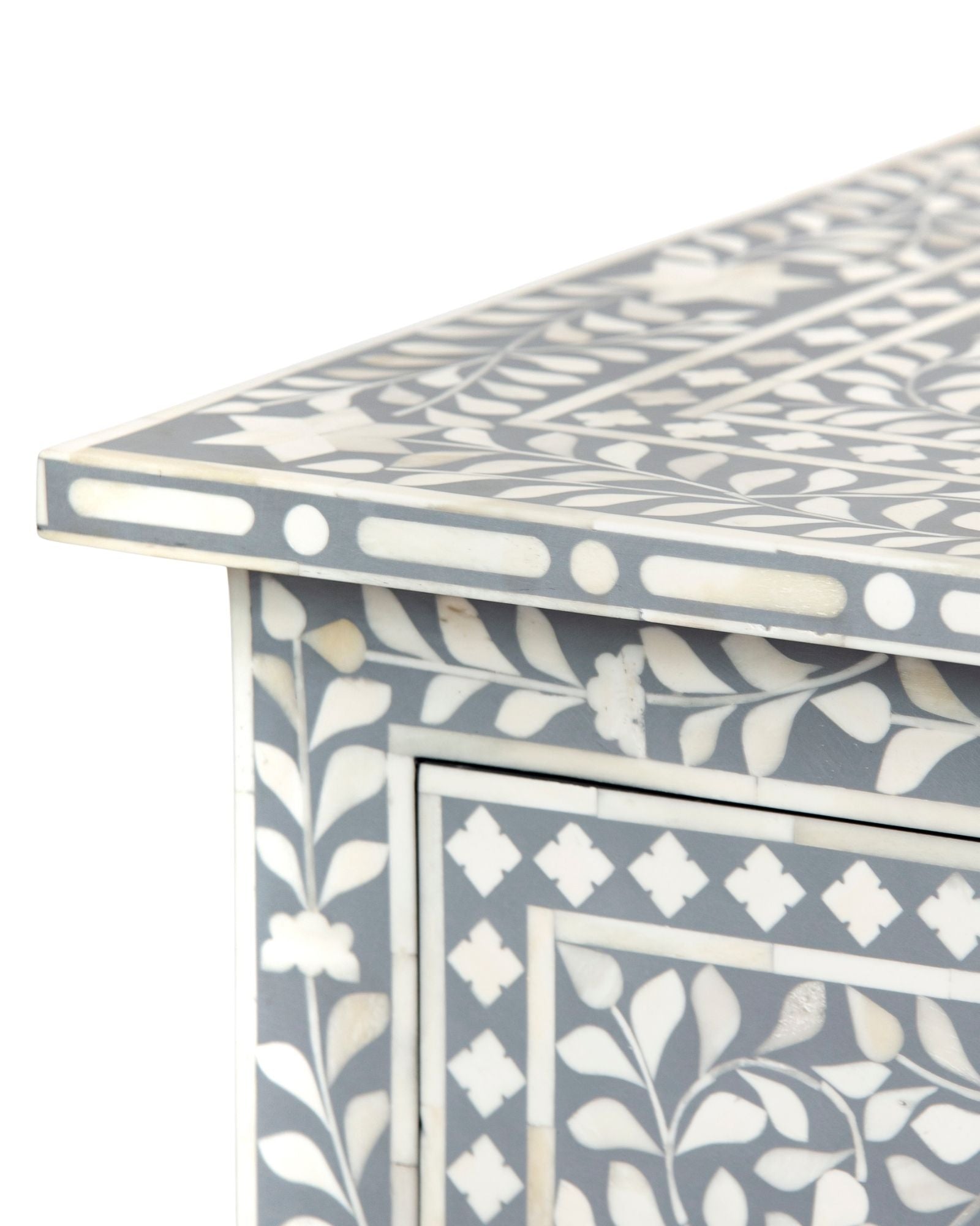 Bone inlay chest of drawers featuring intricate floral pattern in grey and white, handcrafted furniture piece.