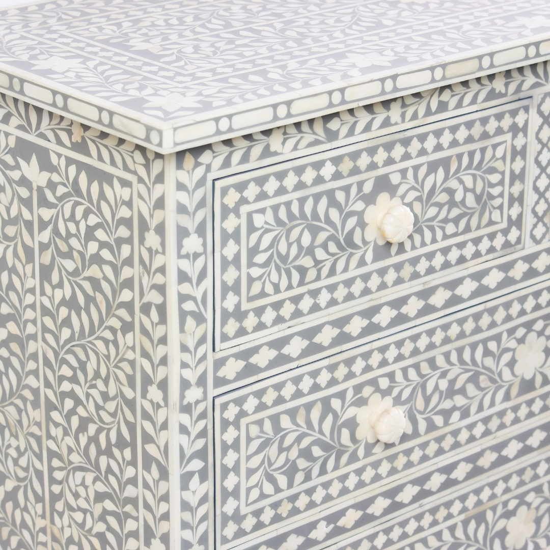 Featuring a Grey Bone Inlay Chest of Drawer in floral pattern, the Jade collection enhances your space with intricately handcrafted designs that elevate your home and living aesthetics. 