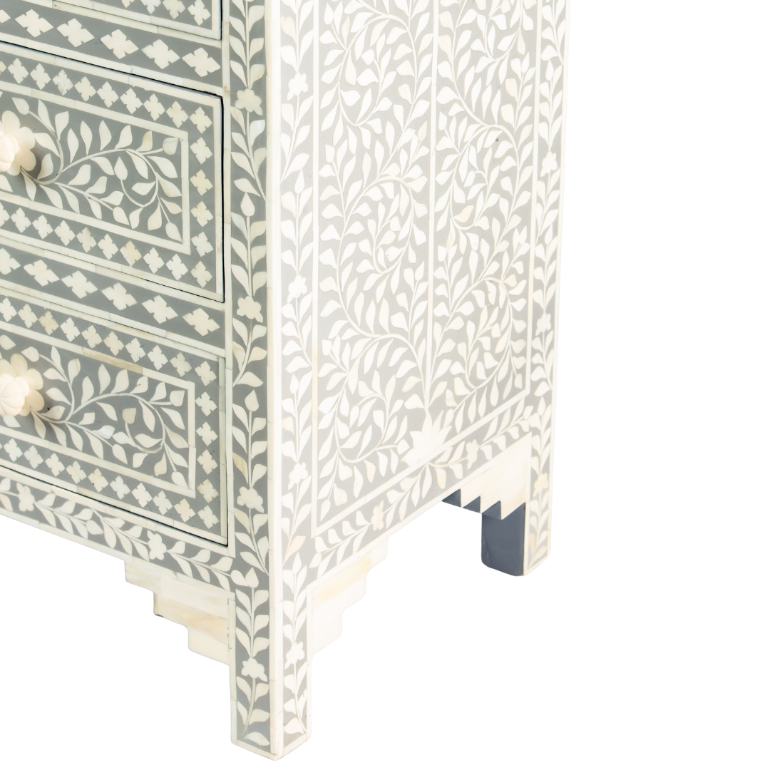 Featuring a Grey Bone Inlay Chest of Drawer in floral pattern, the Jade collection enhances your space with intricately handcrafted designs that elevate your home and living aesthetics. 