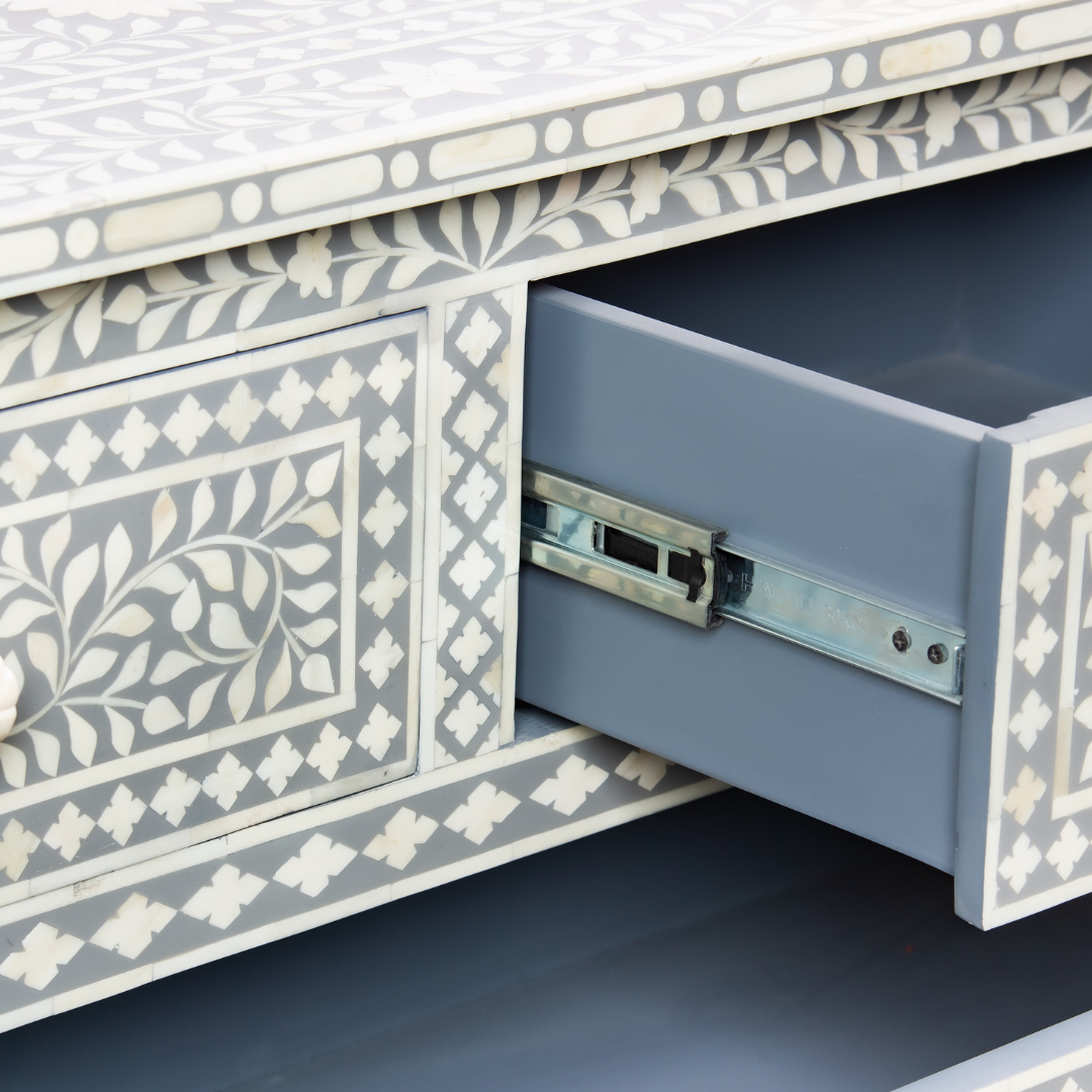 Featuring a Grey Bone Inlay Chest of Drawer in floral pattern, the Jade collection enhances your space with intricately handcrafted designs that elevate your home and living aesthetics. 