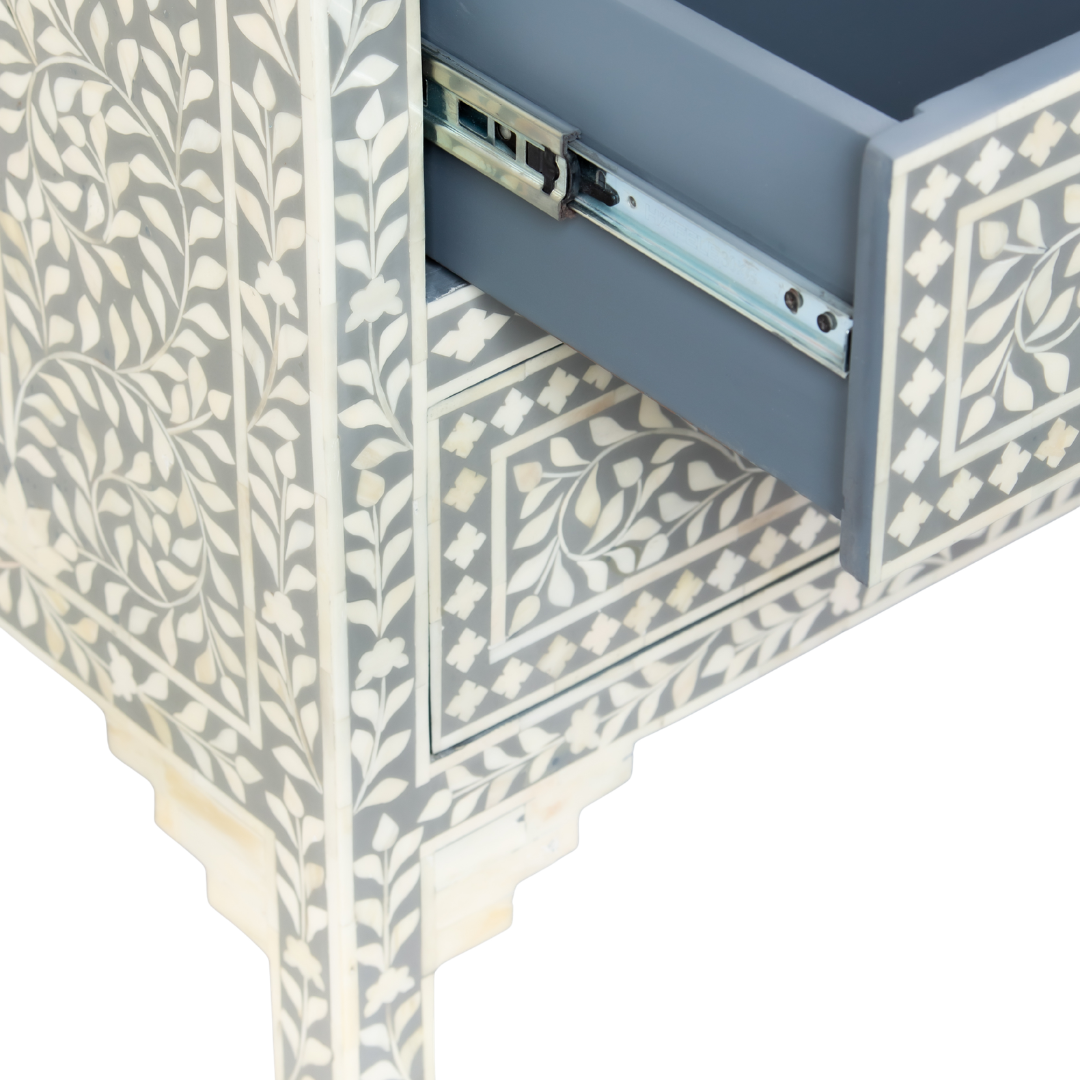 Featuring a Grey Bone Inlay Chest of Drawer in floral pattern, the Jade collection enhances your space with intricately handcrafted designs that elevate your home and living aesthetics. 