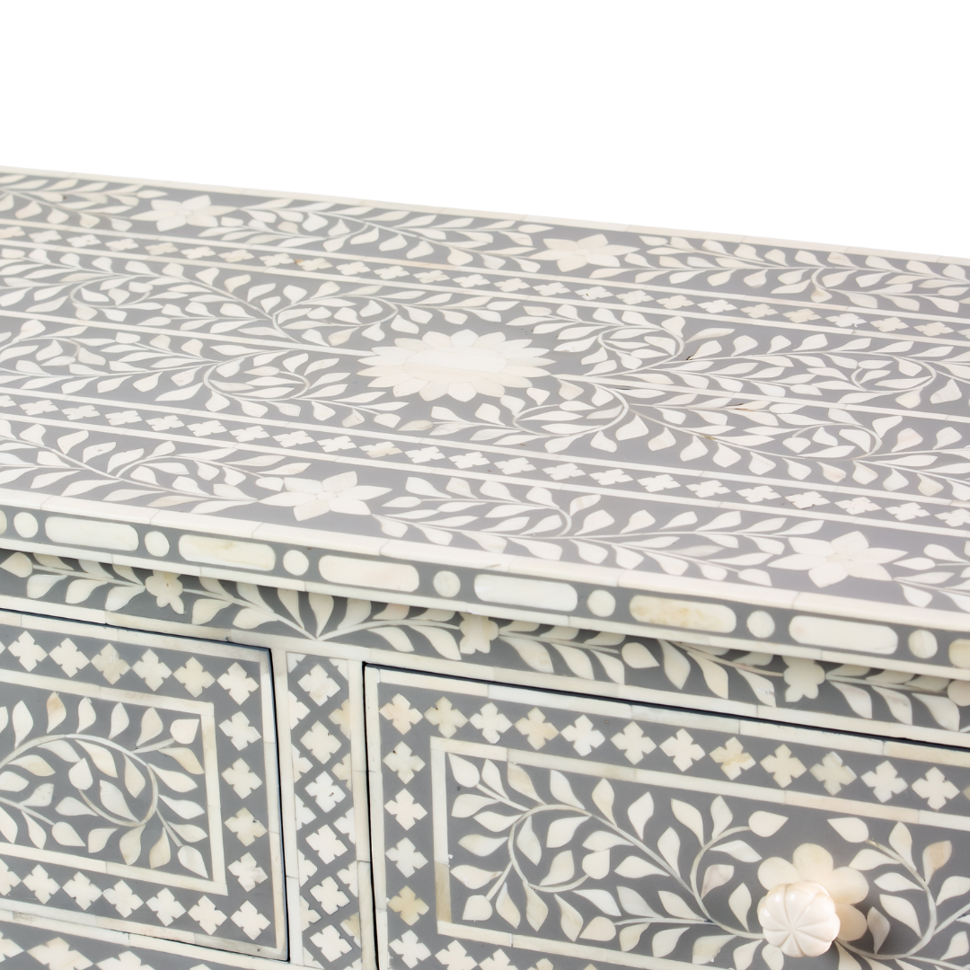 Featuring a Grey Bone Inlay Chest of Drawer in floral pattern, the Jade collection enhances your space with intricately handcrafted designs that elevate your home and living aesthetics. 