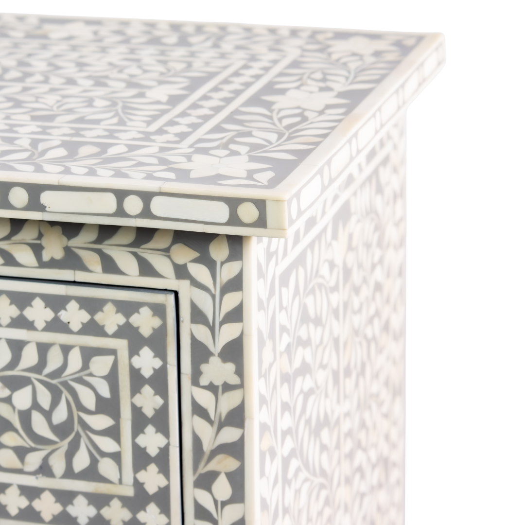 Featuring a Grey Bone Inlay Chest of Drawer in floral pattern, the Jade collection enhances your space with intricately handcrafted designs that elevate your home and living aesthetics. 
