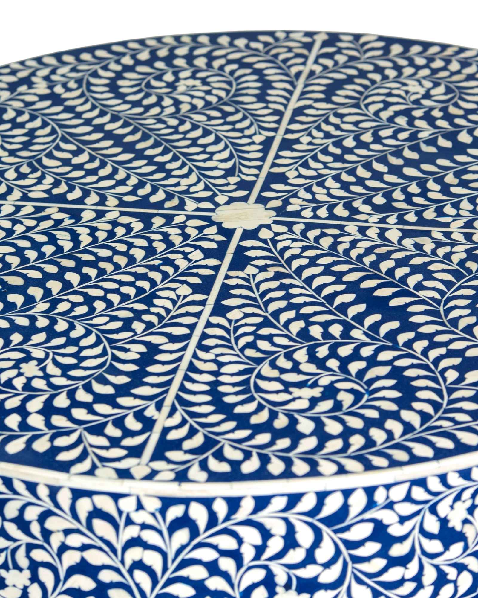 Bone inlay coffee table featuring intricate floral vine pattern in blue and white, handcrafted furniture piece.
