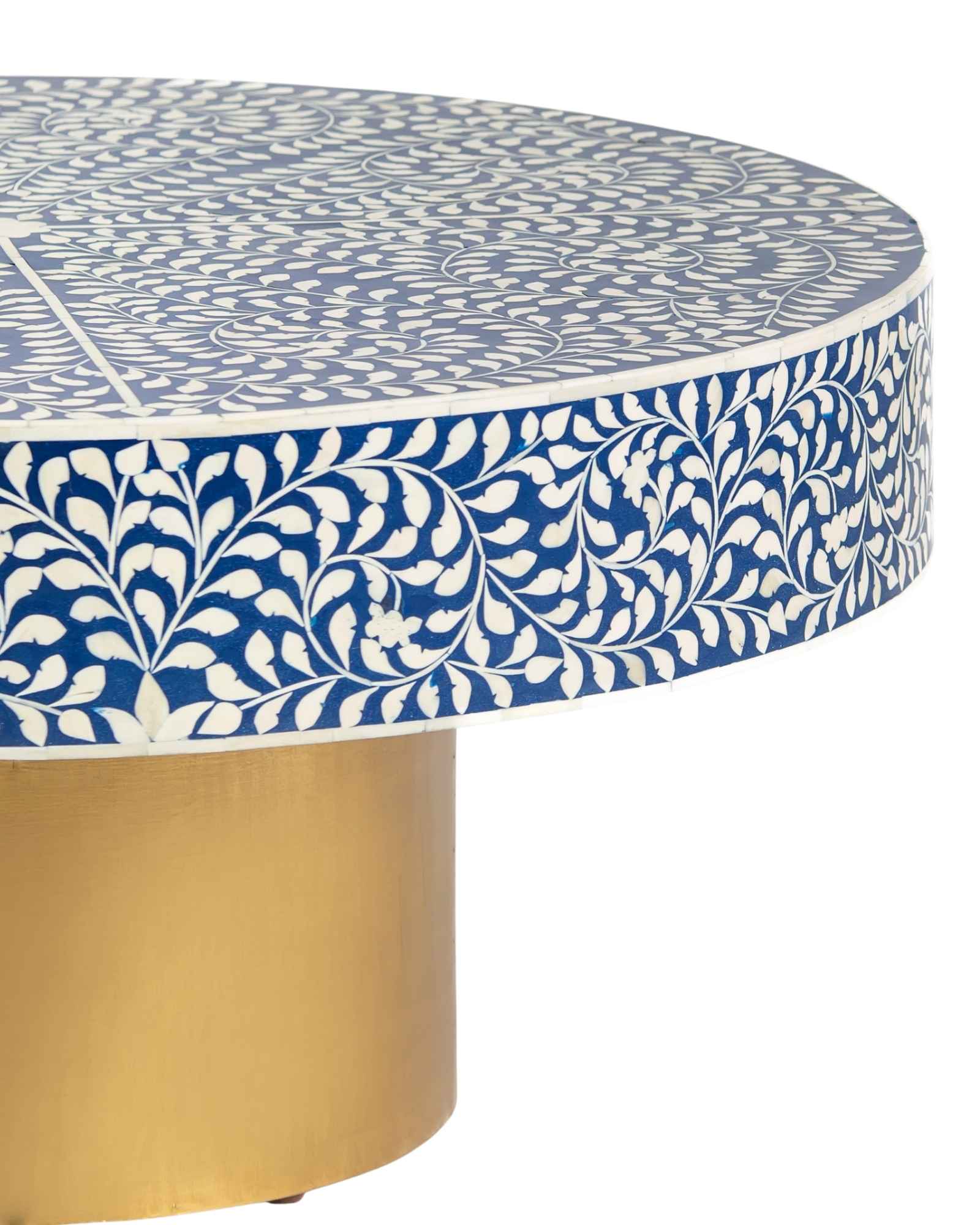 Bone inlay coffee table featuring intricate floral vine pattern in blue and white, handcrafted furniture piece.
