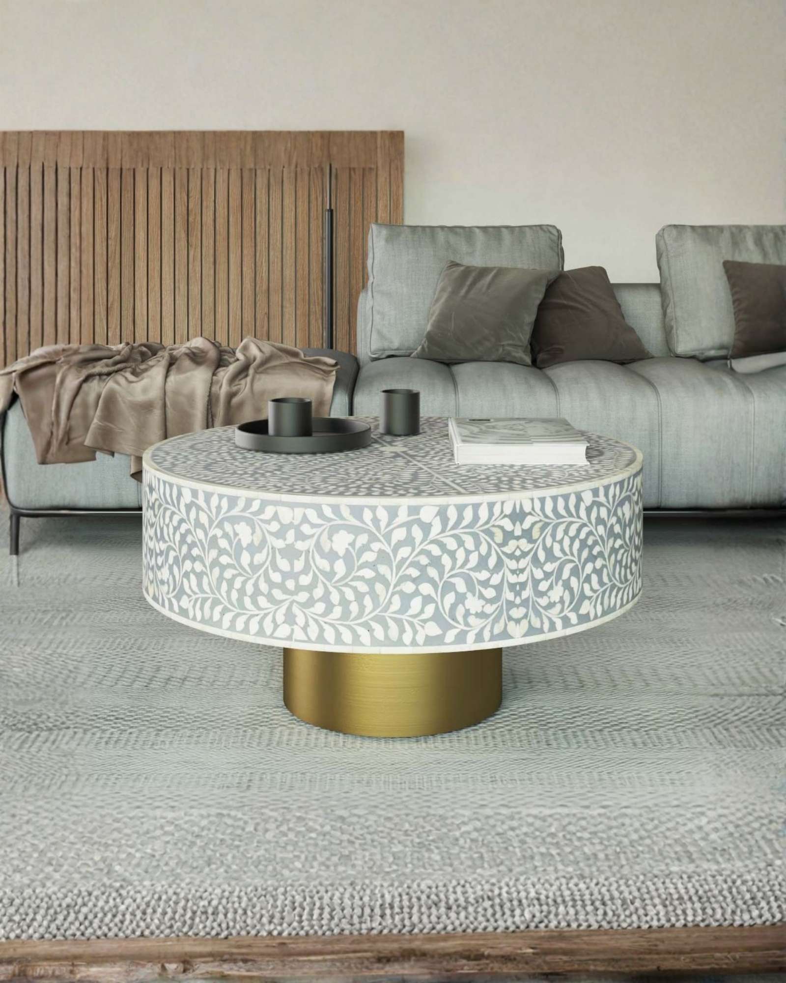 Round grey bone inlay coffee table with floral design and a gold base. Perfect for modern or elegant living room decor.