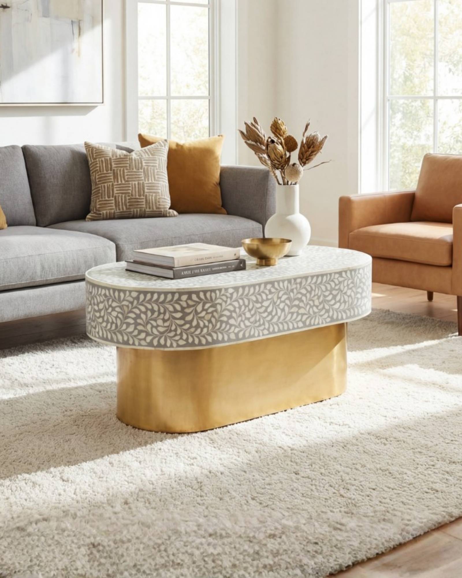 Elegant grey bone inlay coffee table with a gold base. Compact, handcrafted and eye-catching – a timeless addition to your space.