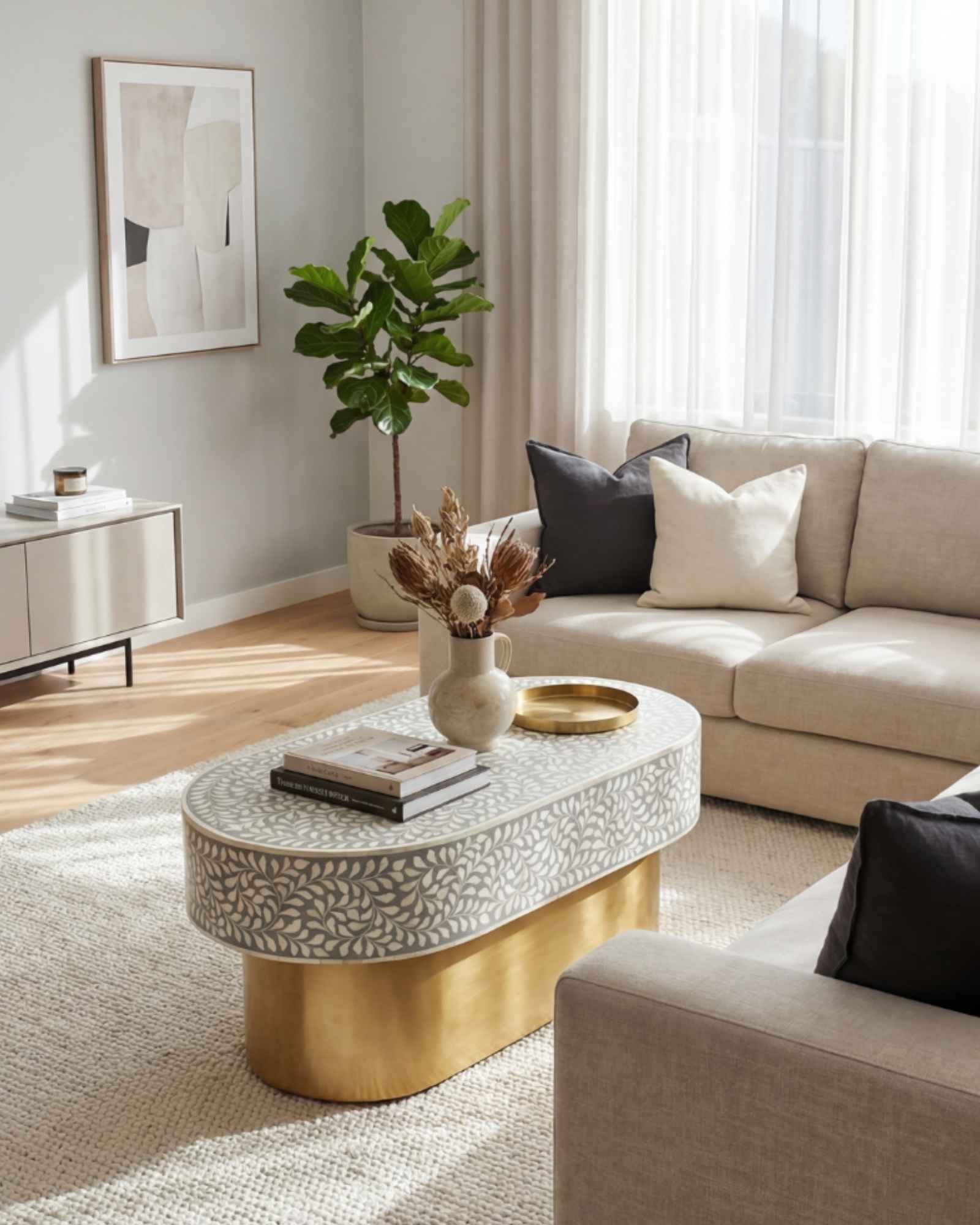 Elegant grey bone inlay coffee table with a gold base. Compact, handcrafted and eye-catching – a timeless addition to your space.