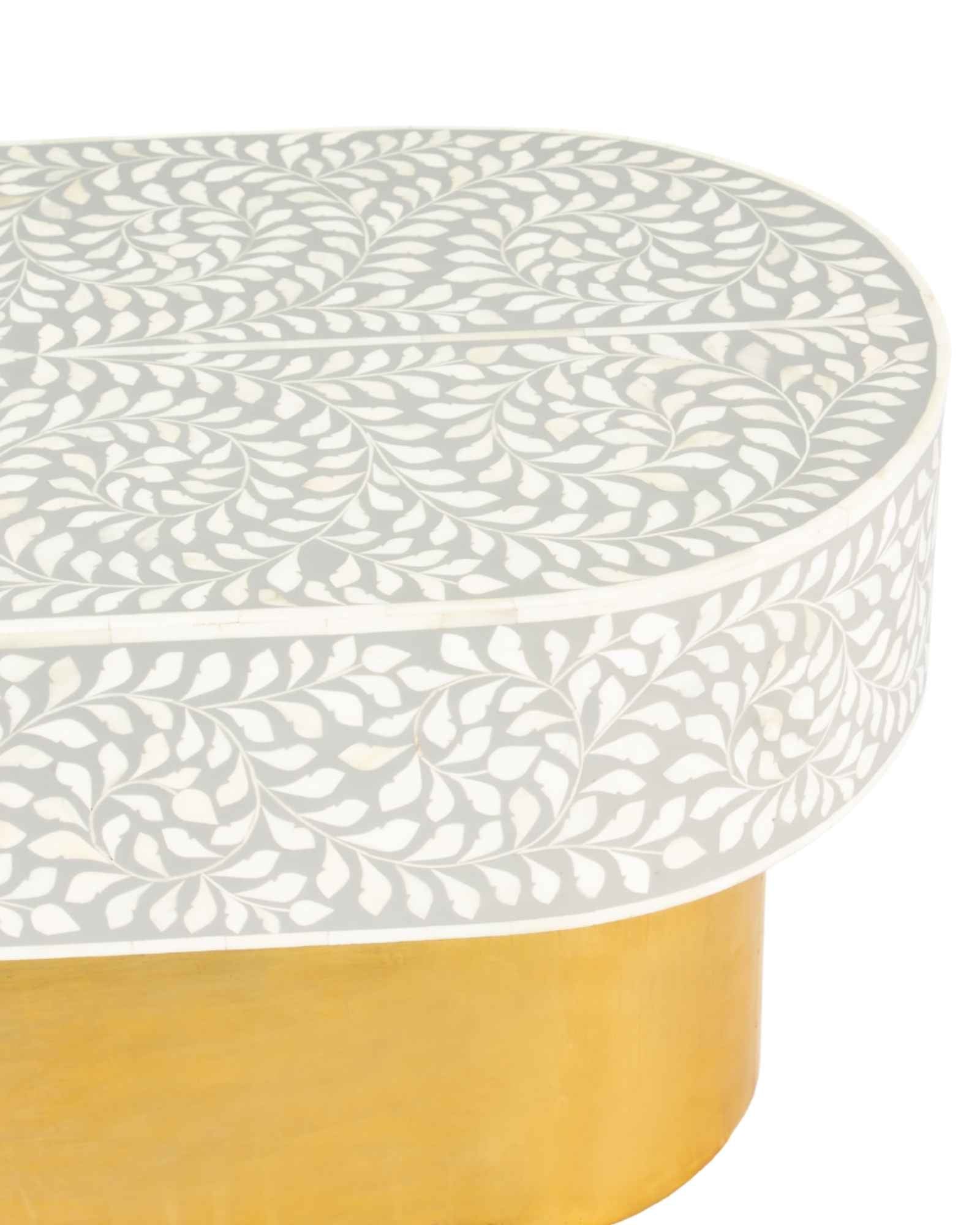Elegant grey bone inlay coffee table with a gold base. Compact, handcrafted and eye-catching – a timeless addition to your space.