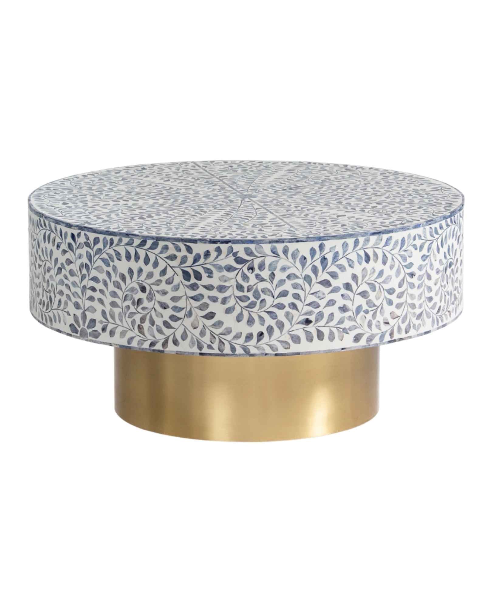 Handcrafted Jade coffee table featuring intricate blue bone inlay detailing with a round silhouette and brushed brass base.