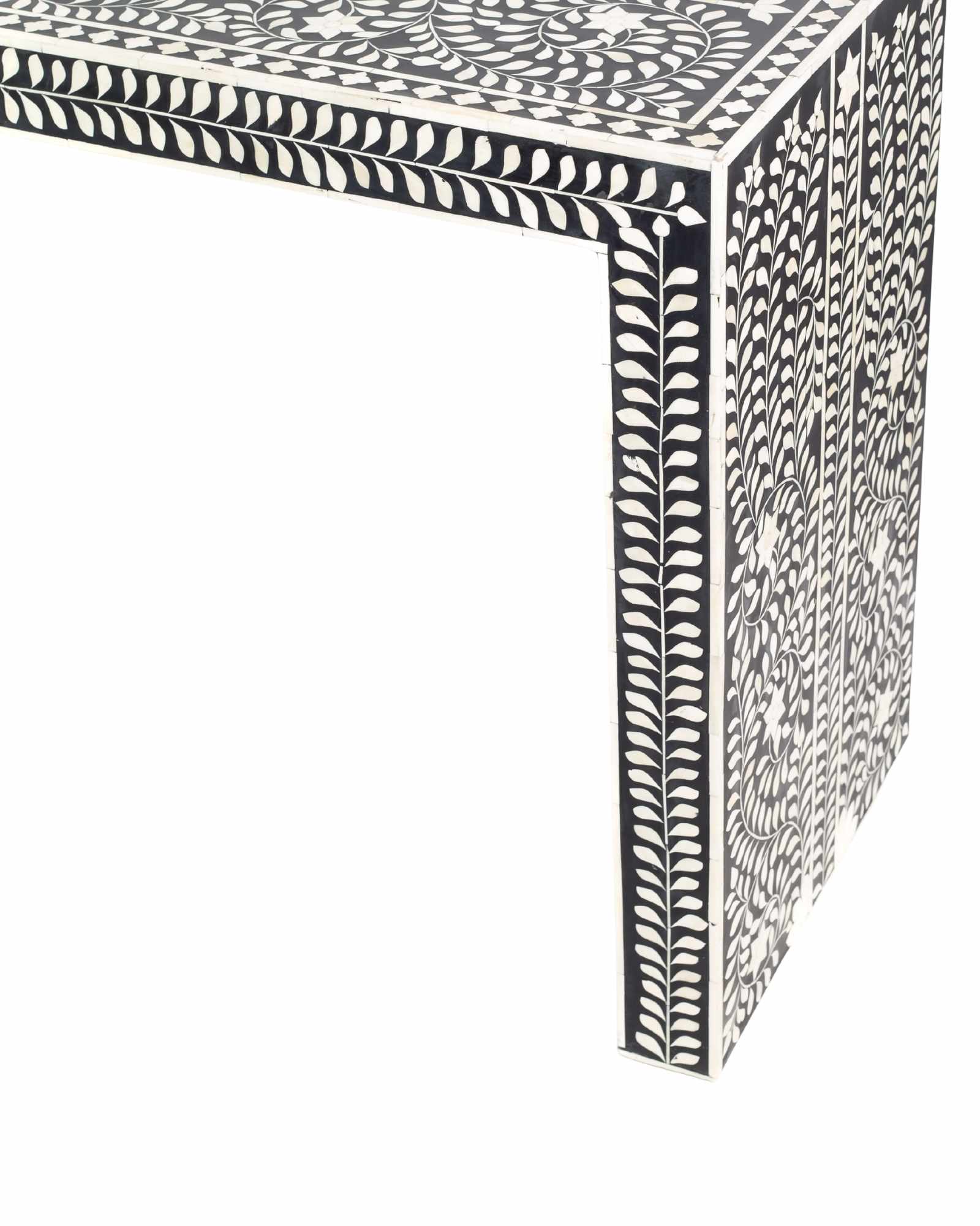 Black bone inlay console table with floral and vine motifs, handcrafted by artisans and finished with intricate detailing across the surface.