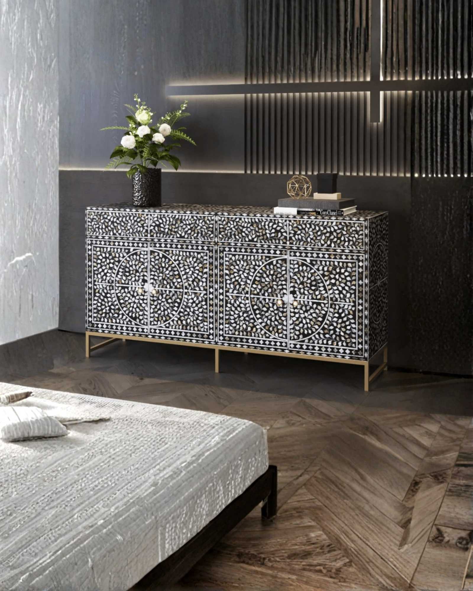 Handcrafted Black & White Sideboard Cabinet with intricate Mother of Pearl inlay, featuring a floral pattern and sleek Metal legs. A luxurious storage solution for any space.