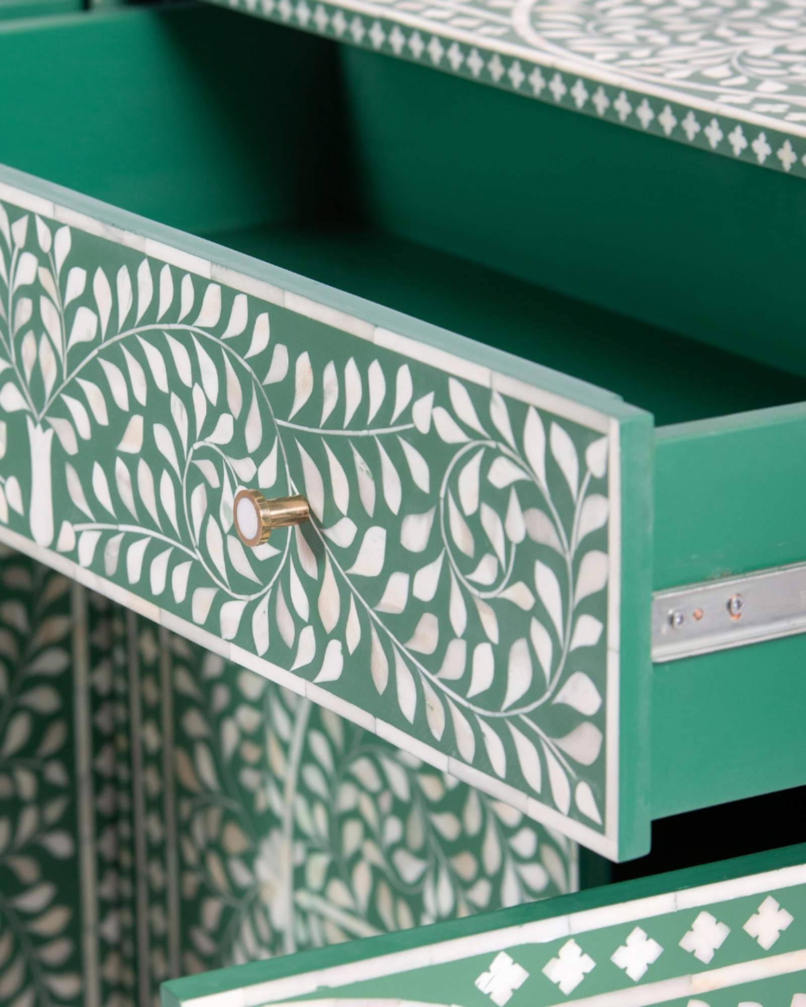 Featuring a beautiful floral sideboard in Green Bone Inlay with intricate hand inlaid work. Part of the Jade Collection - this buffet can be used as at an entryway or as a cutlery storage unit.