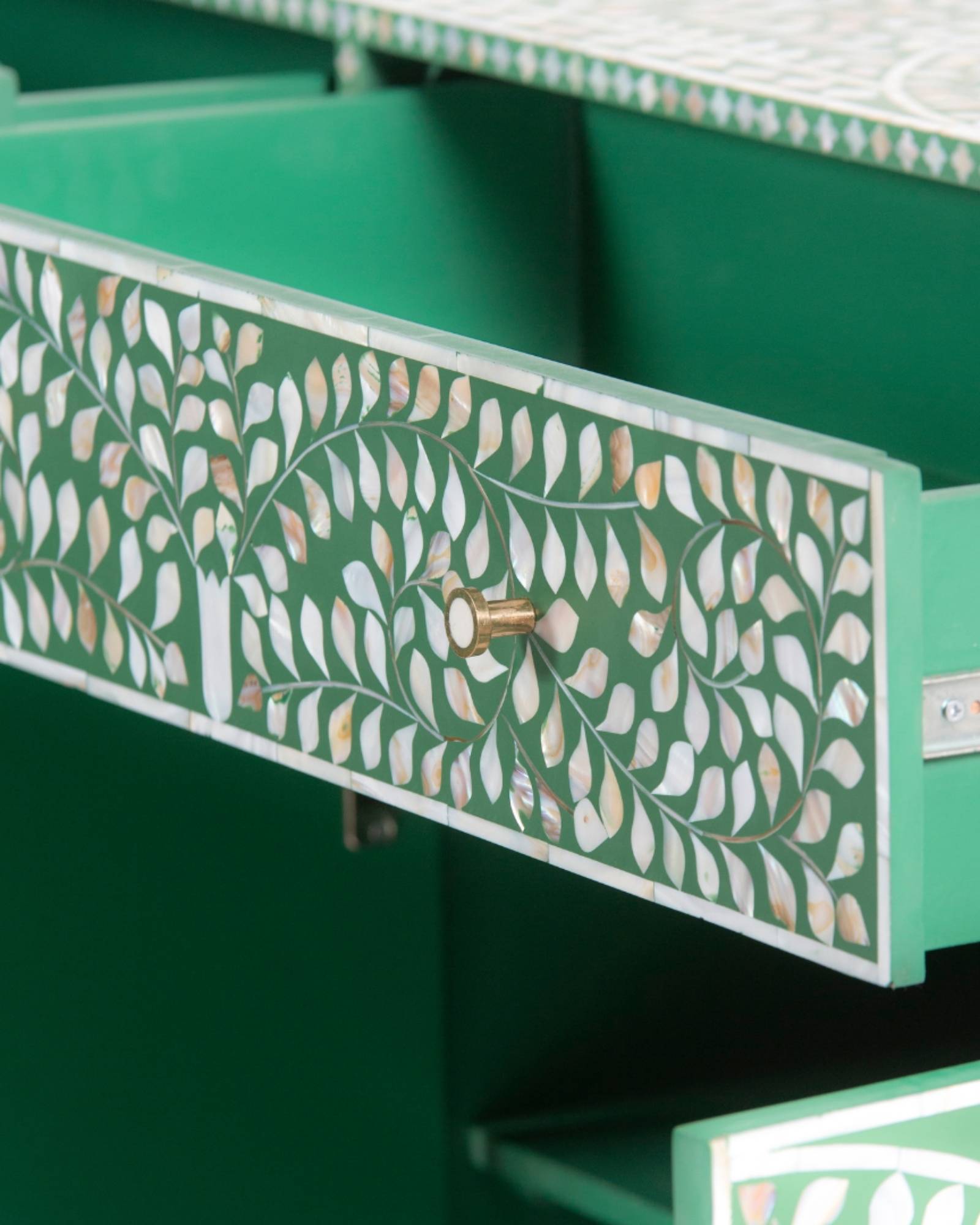Featuring a beautiful floral sideboard in Green Mother of Pearl Inlay with intricate hand inlaid work. Part of the Iris Collection - this buffet can be used as at an entryway or as a cutlery storage unit.