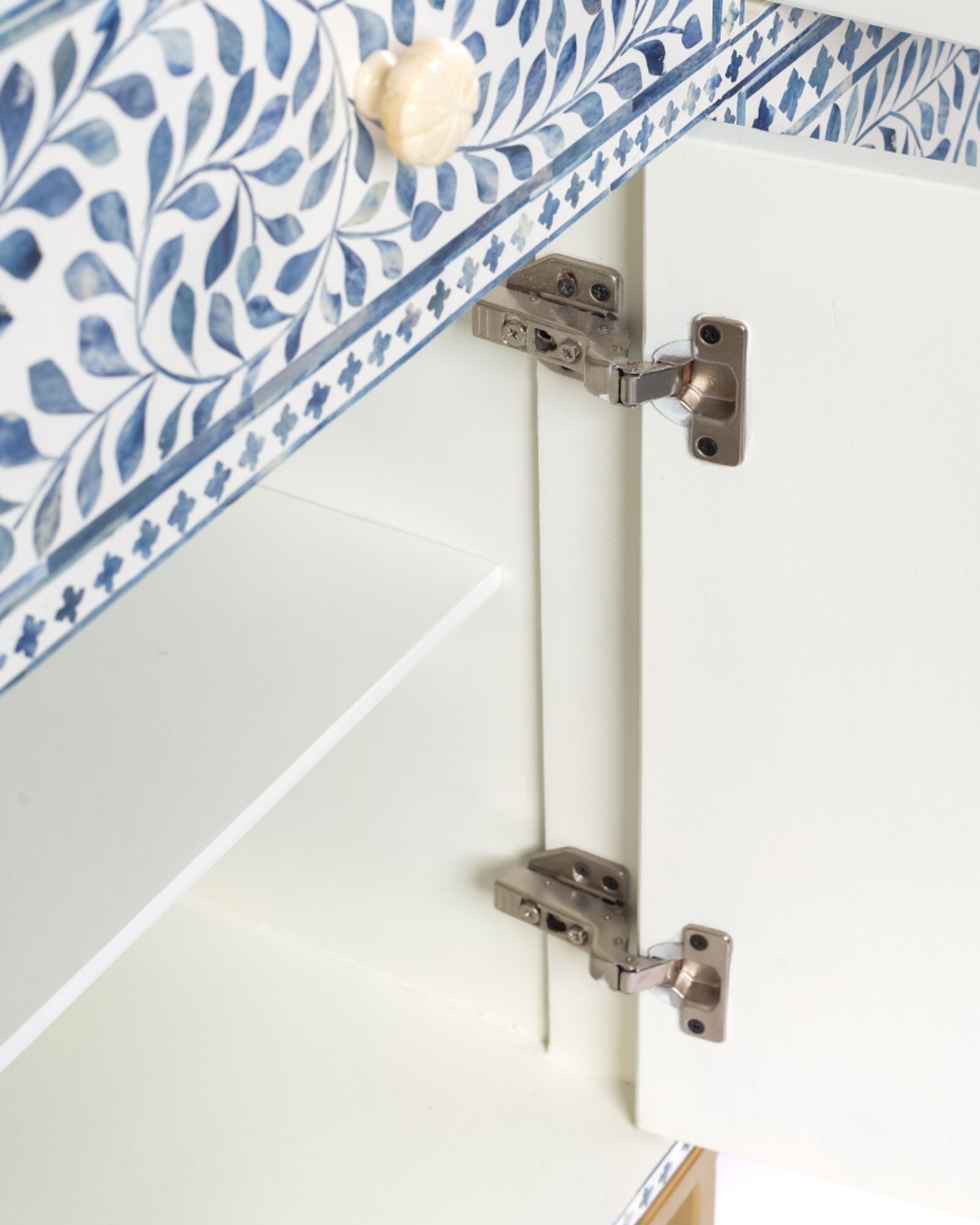Featuring a beautiful floral sideboard in Dyed Blue Bone Inlay with intricate hand inlaid work. Part of the Jade Collection - this buffet can be used as at an entryway or as a cutlery storage unit.