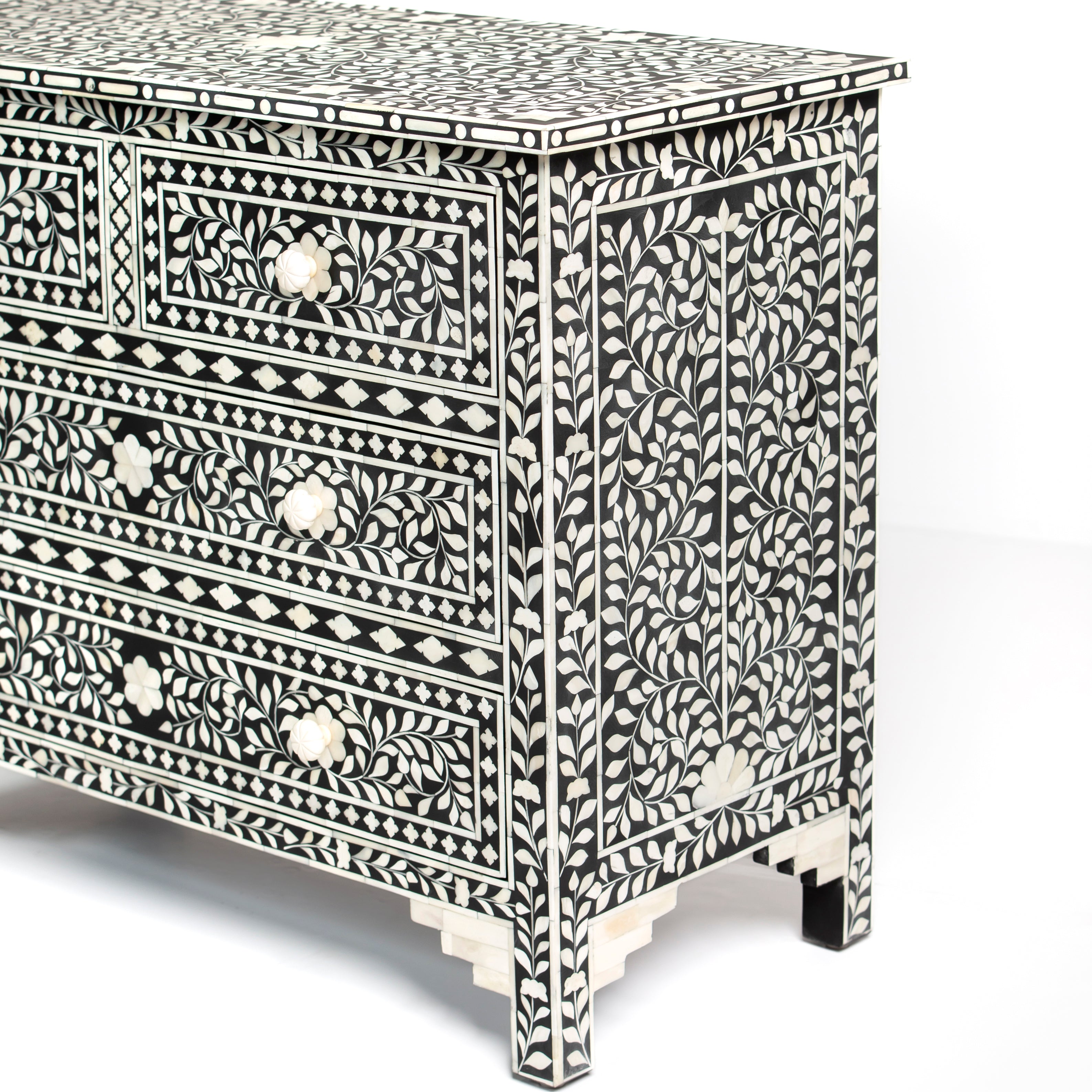 Bone inlay chest of drawers featuring intricate floral pattern in black and white, handcrafted furniture piece