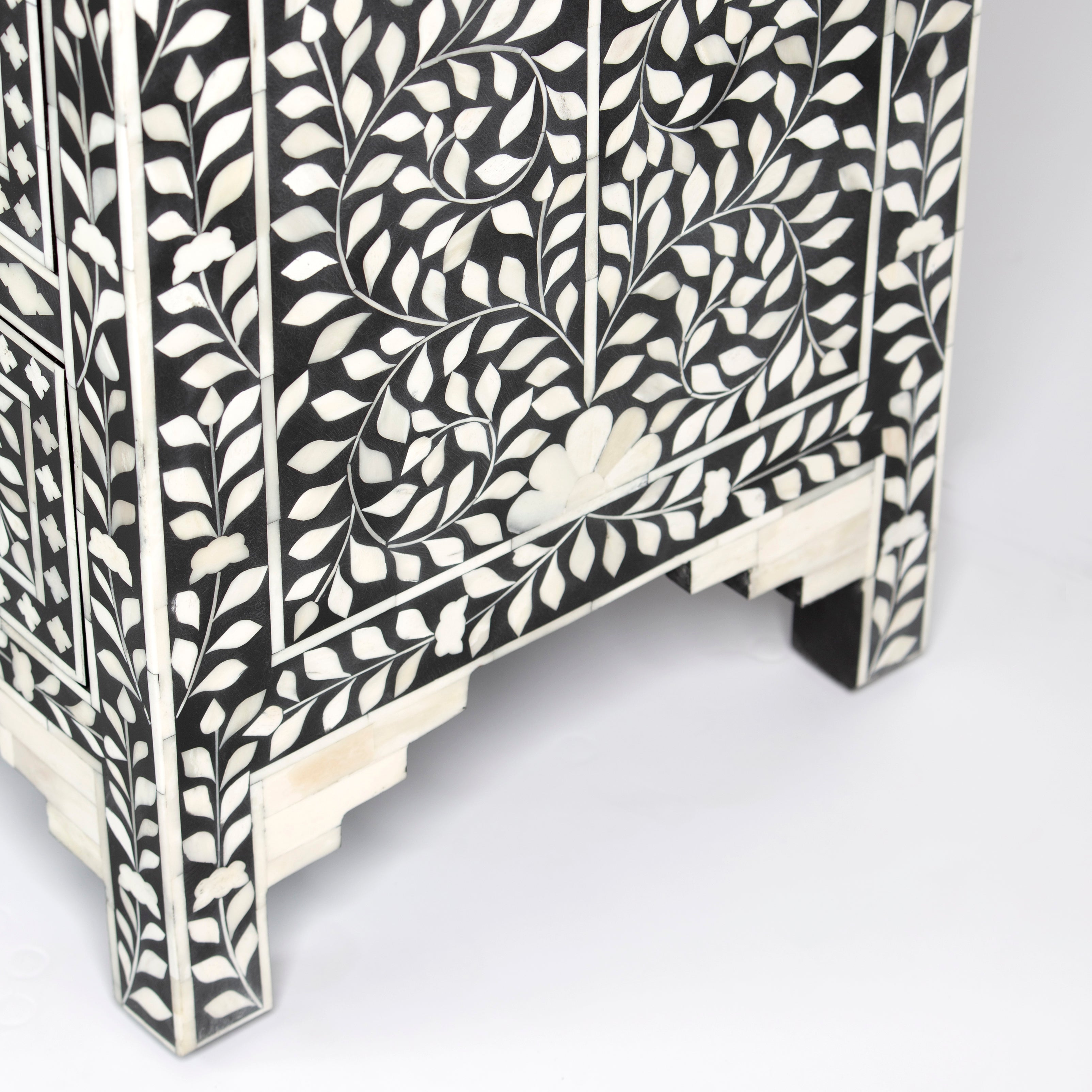 Bone inlay chest of drawers featuring intricate floral pattern in black and white, handcrafted furniture piece
