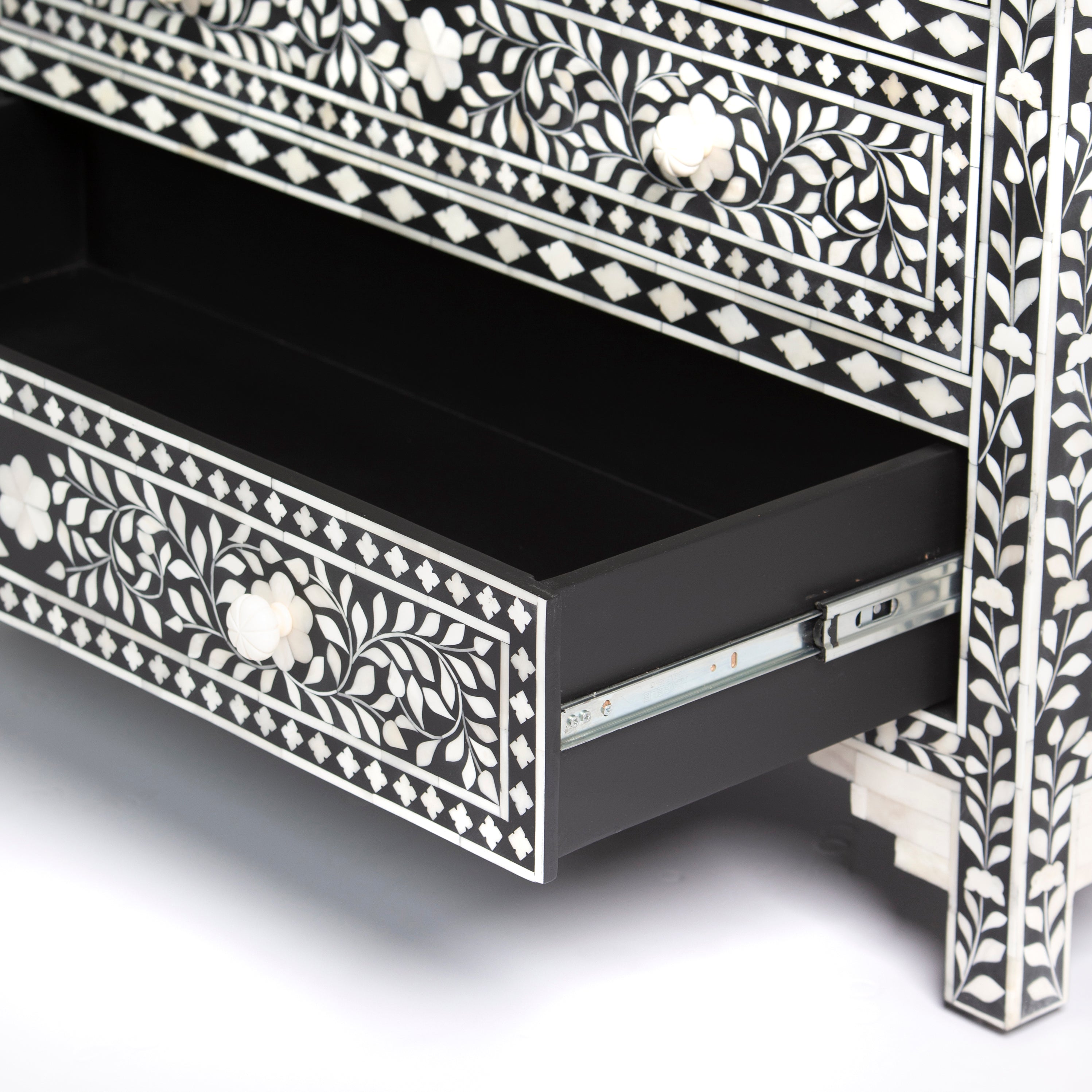 Bone inlay chest of drawers featuring intricate floral pattern in black and white, handcrafted furniture piece
