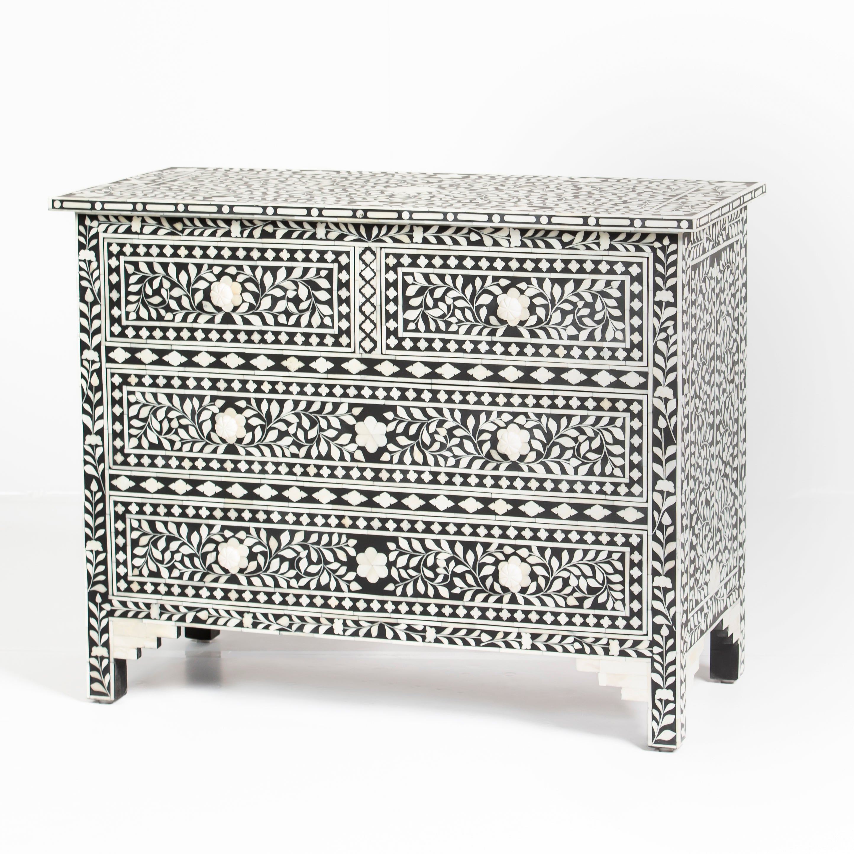 Bone inlay chest of drawers featuring intricate floral pattern in black and white, handcrafted furniture piece