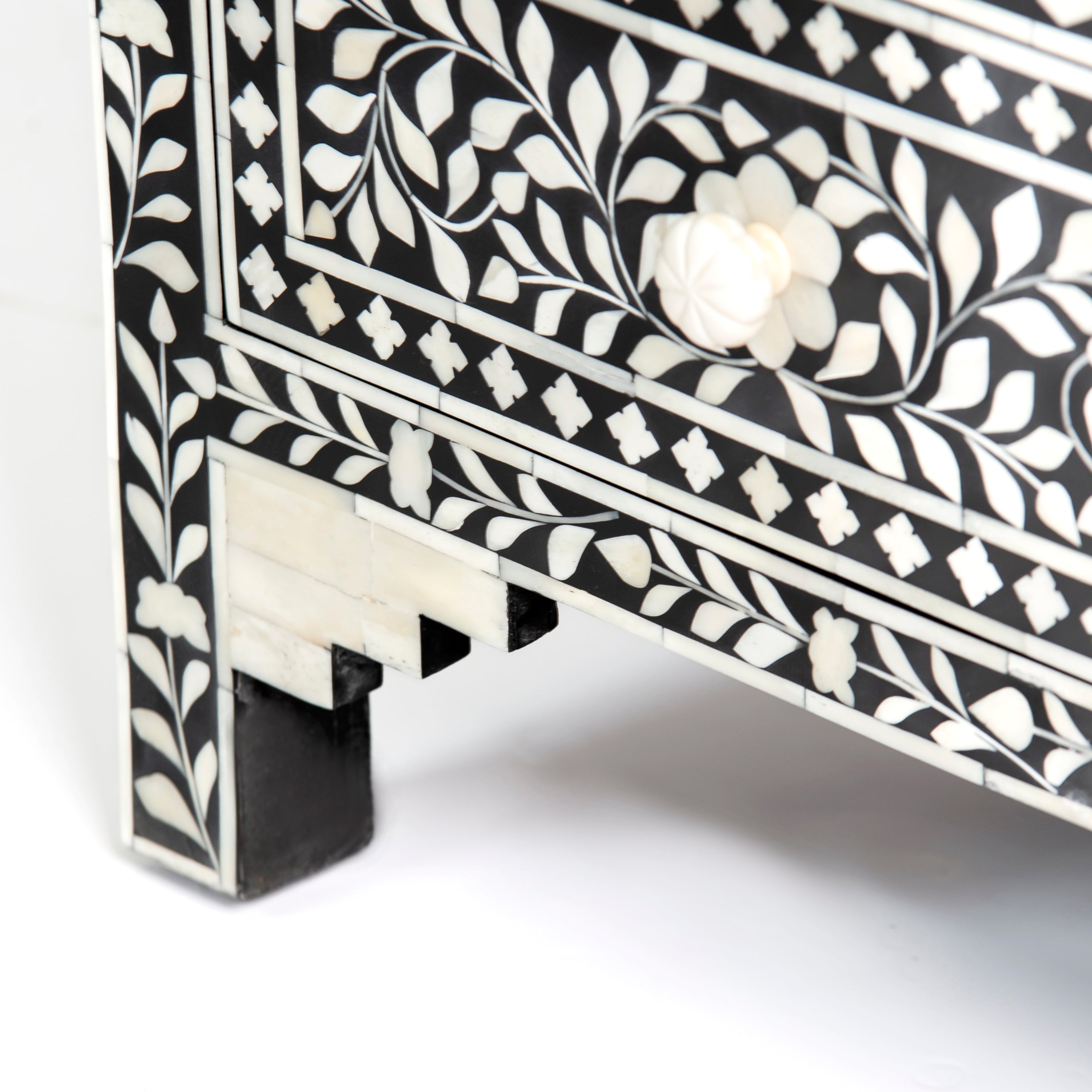 Bone inlay chest of drawers featuring intricate floral pattern in black and white, handcrafted furniture piece