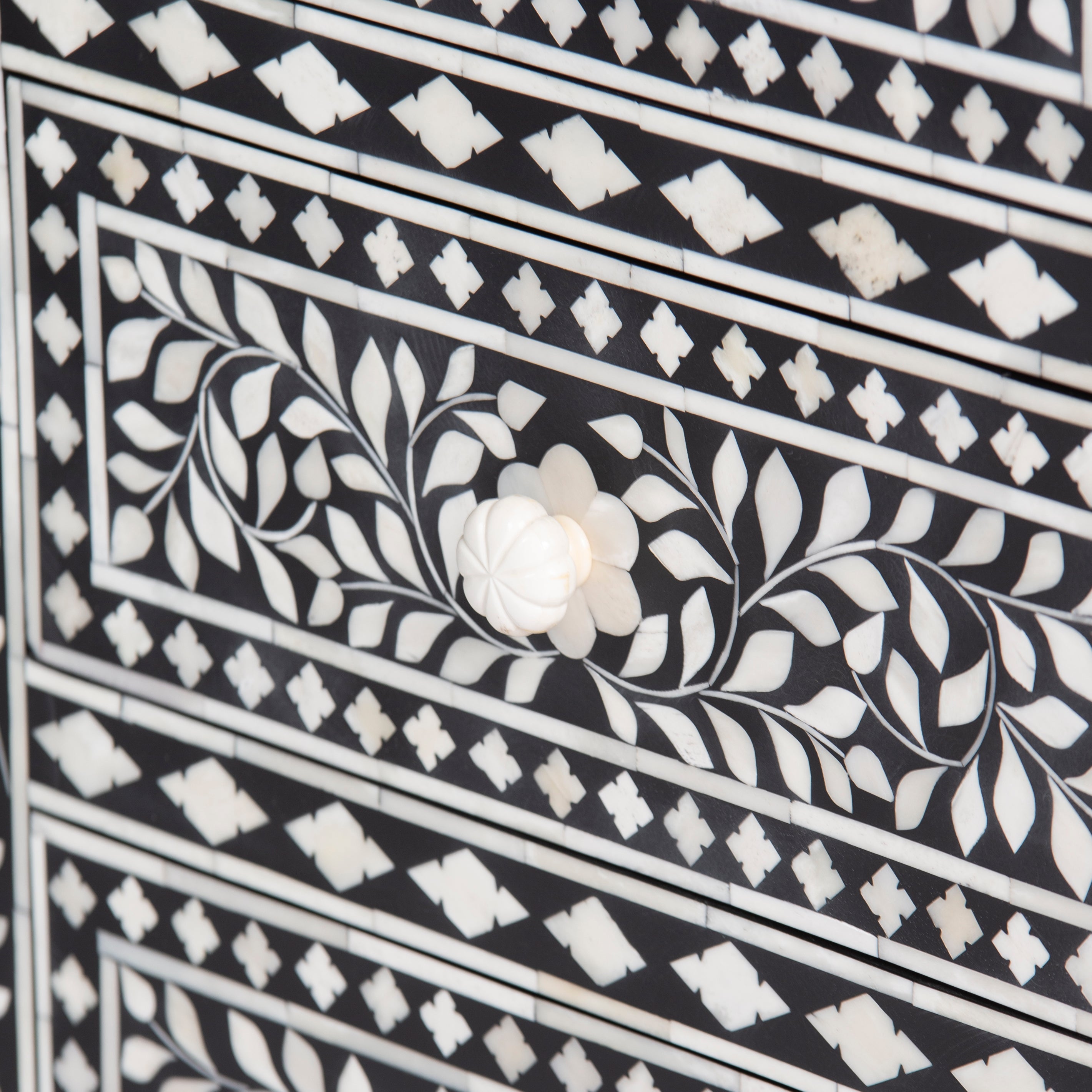 Bone inlay chest of drawers featuring intricate floral pattern in black and white, handcrafted furniture piece
