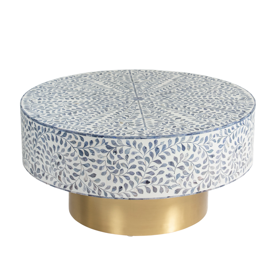 Handcrafted Jade coffee table featuring intricate blue bone inlay detailing with a round silhouette and brushed brass base.
