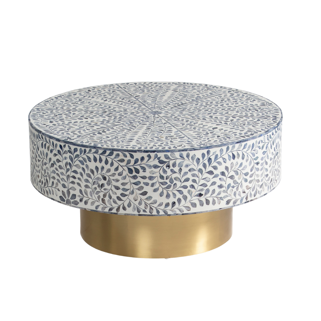 Handcrafted Jade coffee table featuring intricate blue bone inlay detailing with a round silhouette and brushed brass base.
