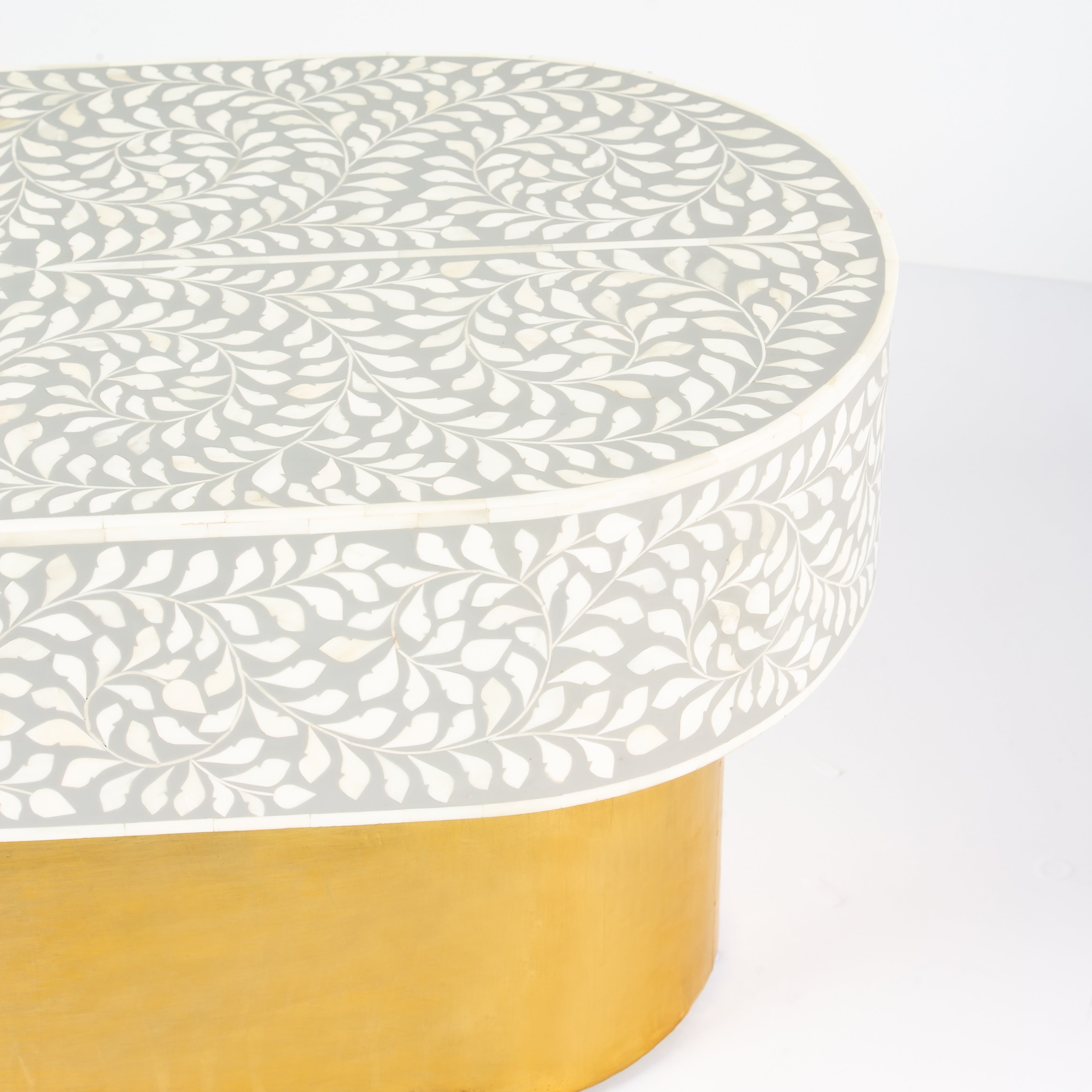 Elegant grey bone inlay coffee table with a gold base. Compact, handcrafted and eye-catching – a timeless addition to your space.
