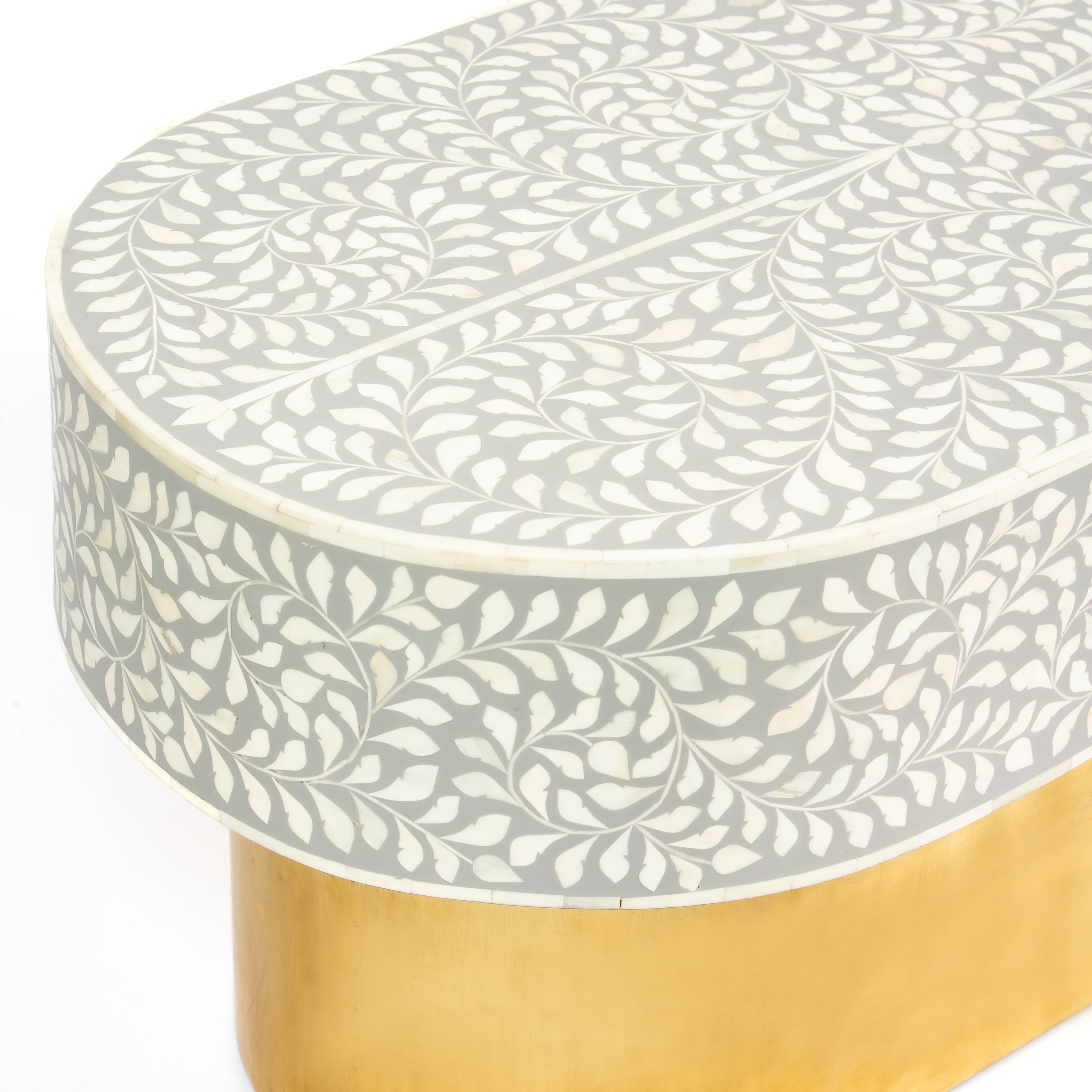 Elegant grey bone inlay coffee table with a gold base. Compact, handcrafted and eye-catching – a timeless addition to your space.