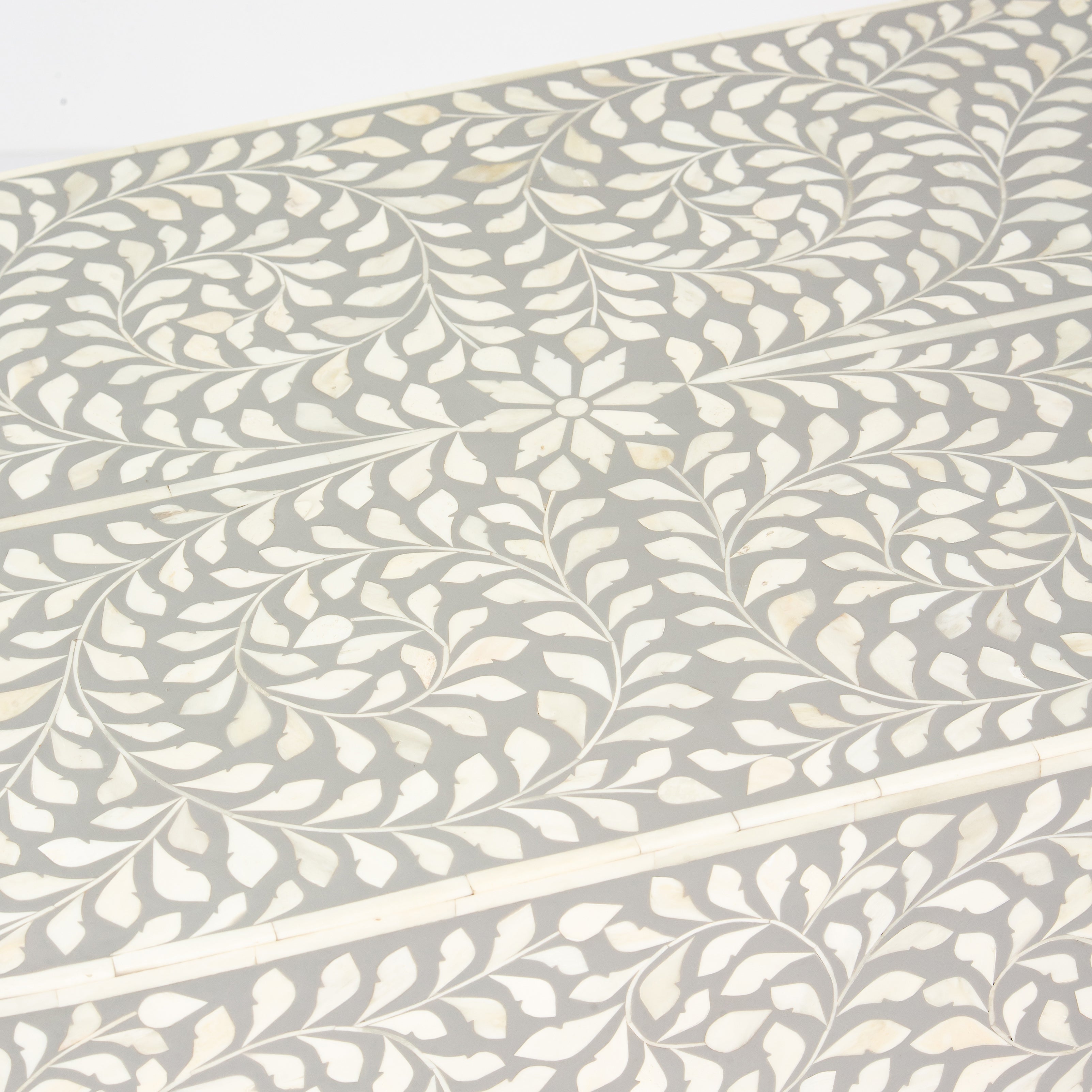 Elegant grey bone inlay coffee table with a gold base. Compact, handcrafted and eye-catching – a timeless addition to your space.