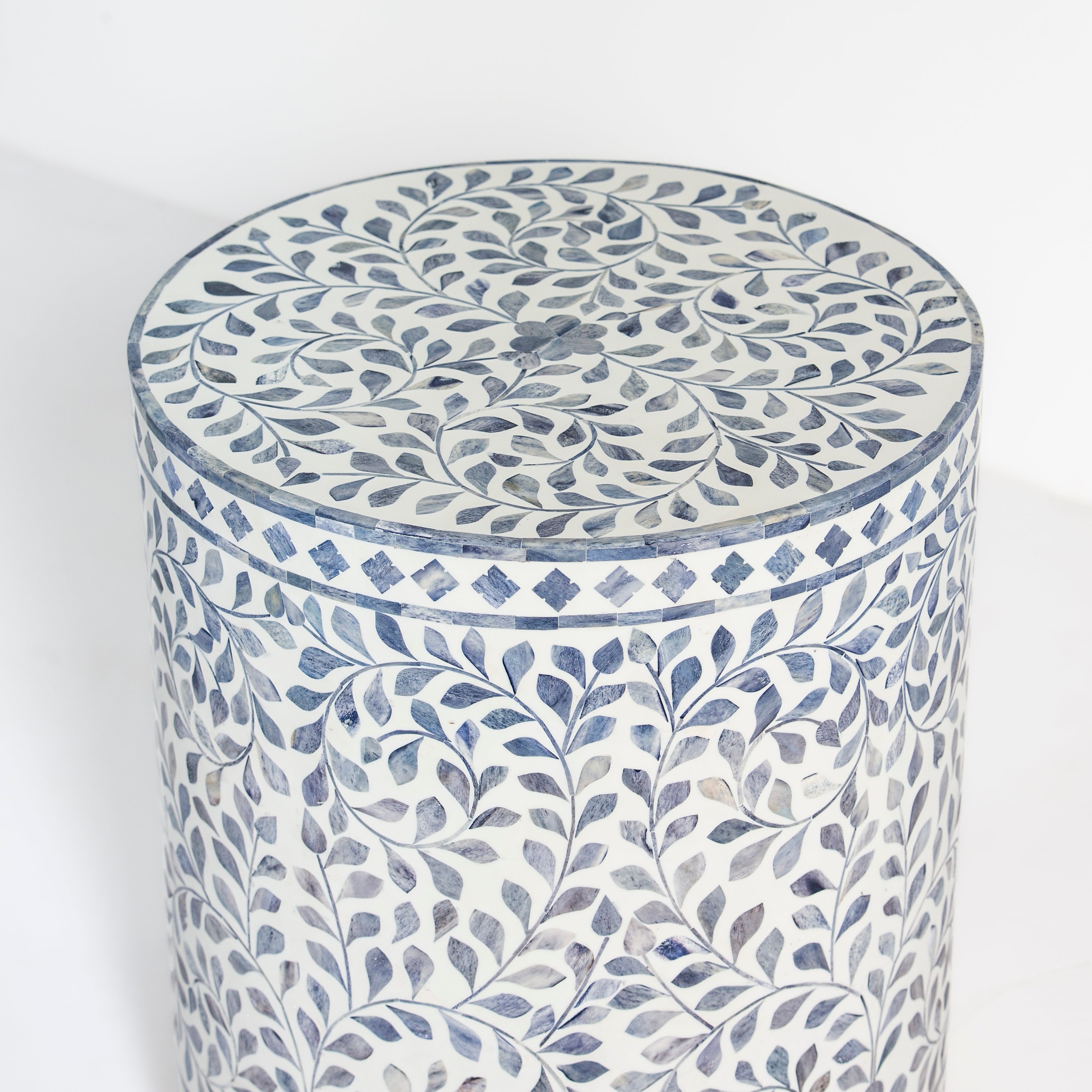 Handcrafted Jade side table featuring intricate blue bone inlay with a cylindrical silhouette and refined artisanal detailing.