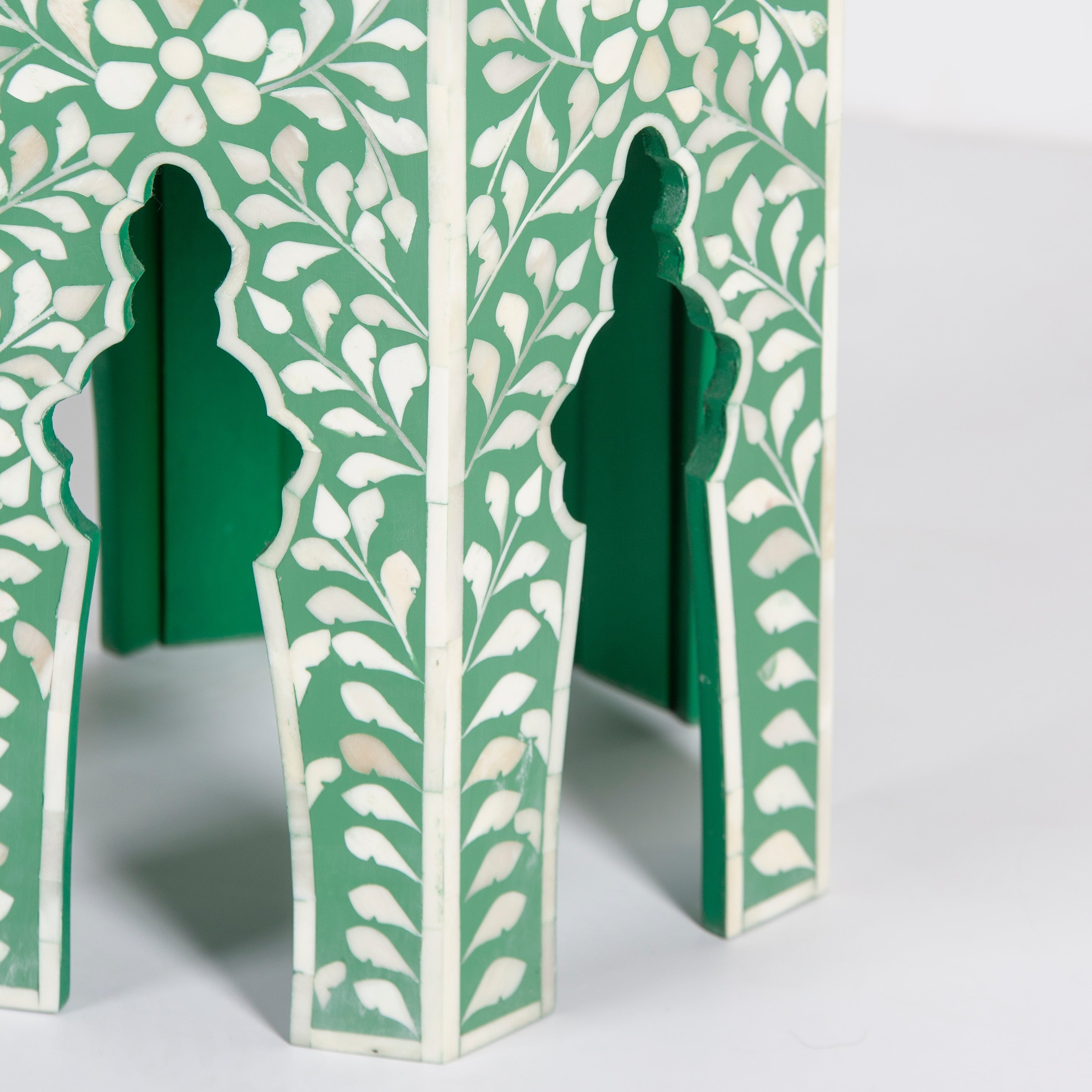 Handcrafted Jade side table featuring green bone inlay with a hexagonal silhouette, floral detailing, and arched legs.