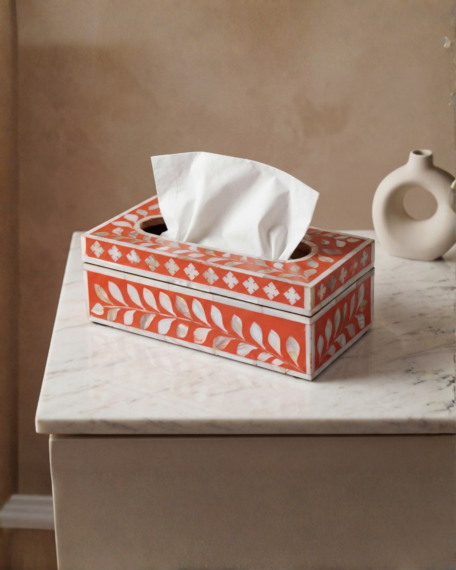 Orange mother of pearl inlay tissue box with floral pattern, handcrafted decorative tissue holder in wood.
