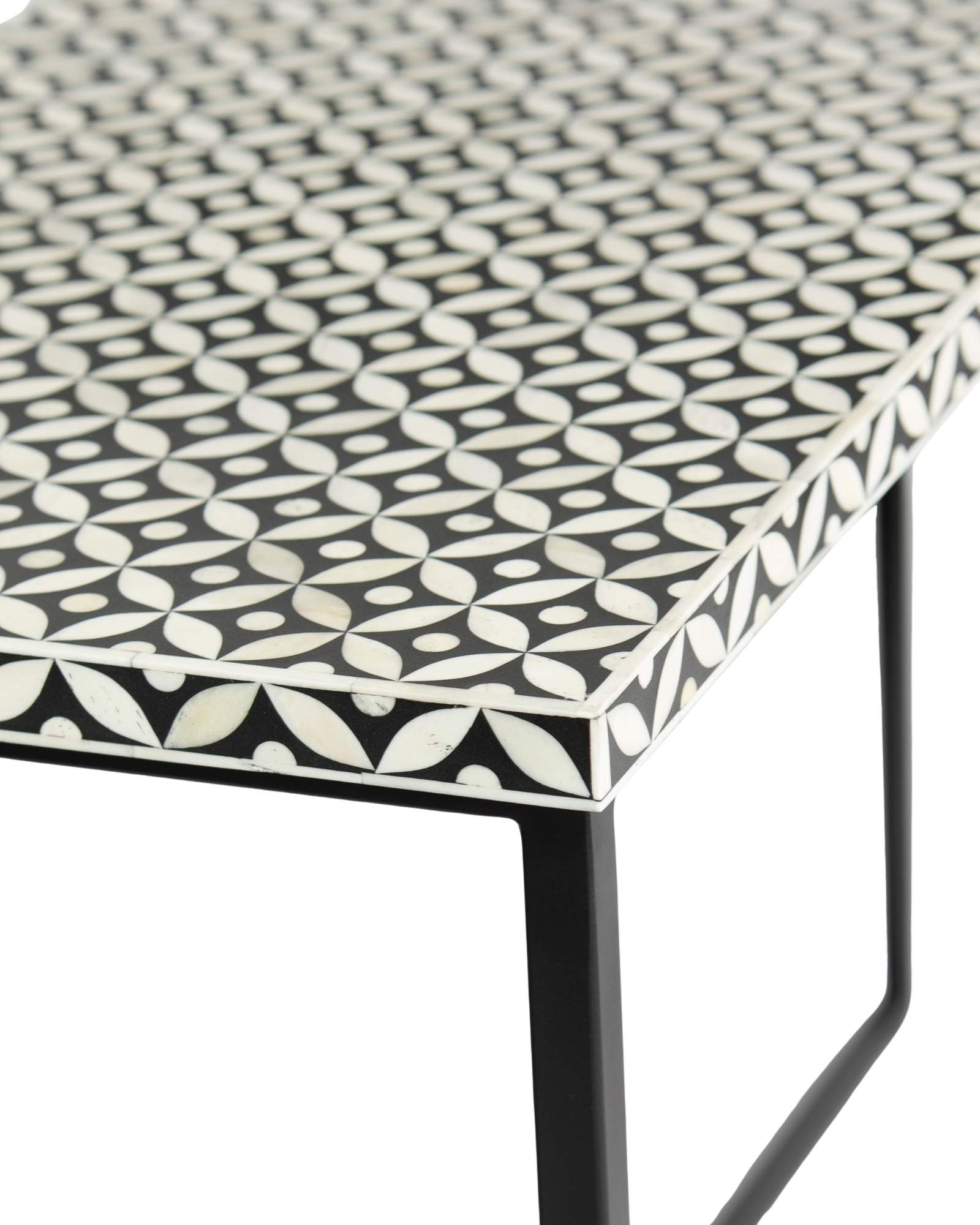 Bone inlay console table featuring geometric pattern in black and white with metal base, handcrafted furniture piece.