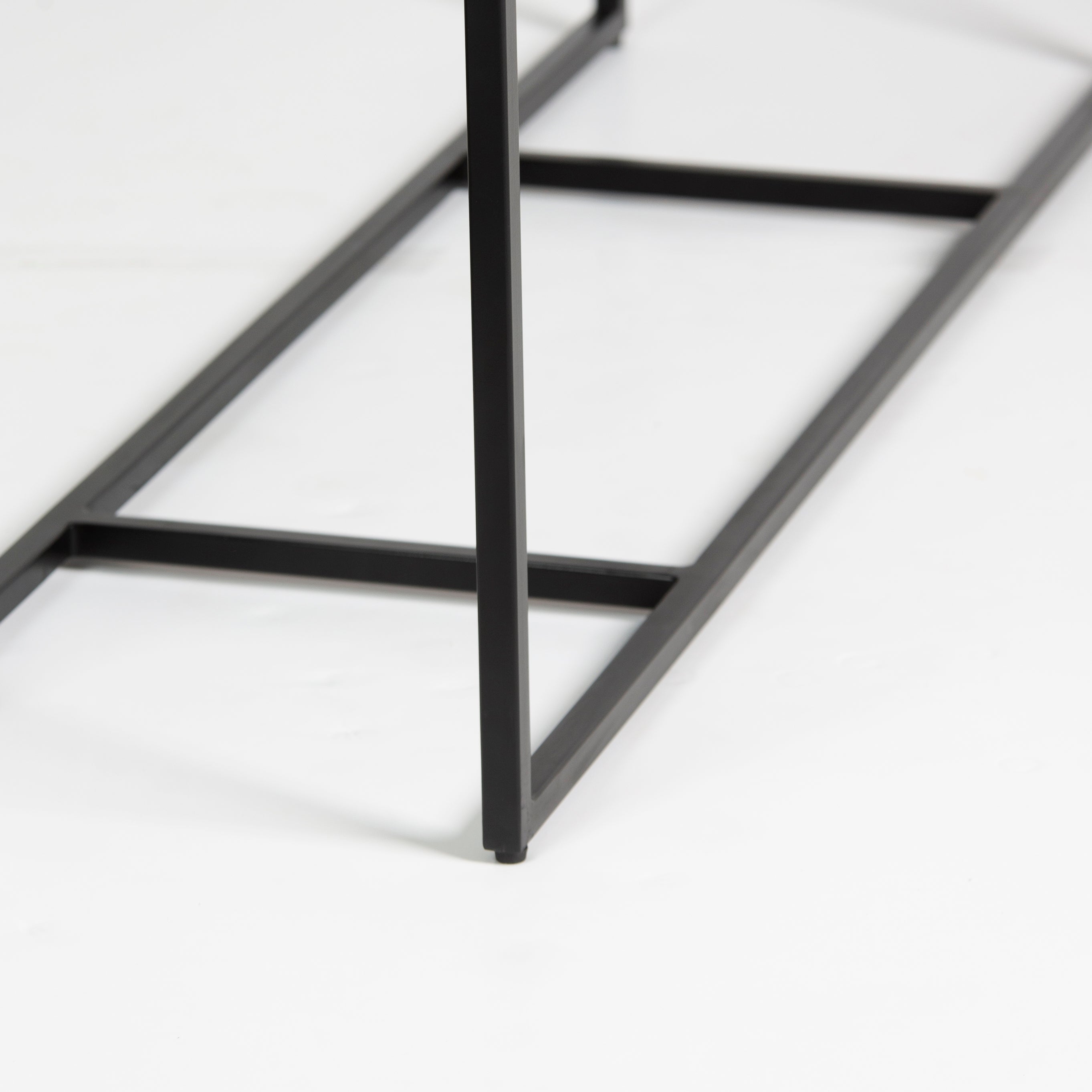 Bone inlay console table featuring geometric pattern in black and white with metal base, handcrafted furniture piece