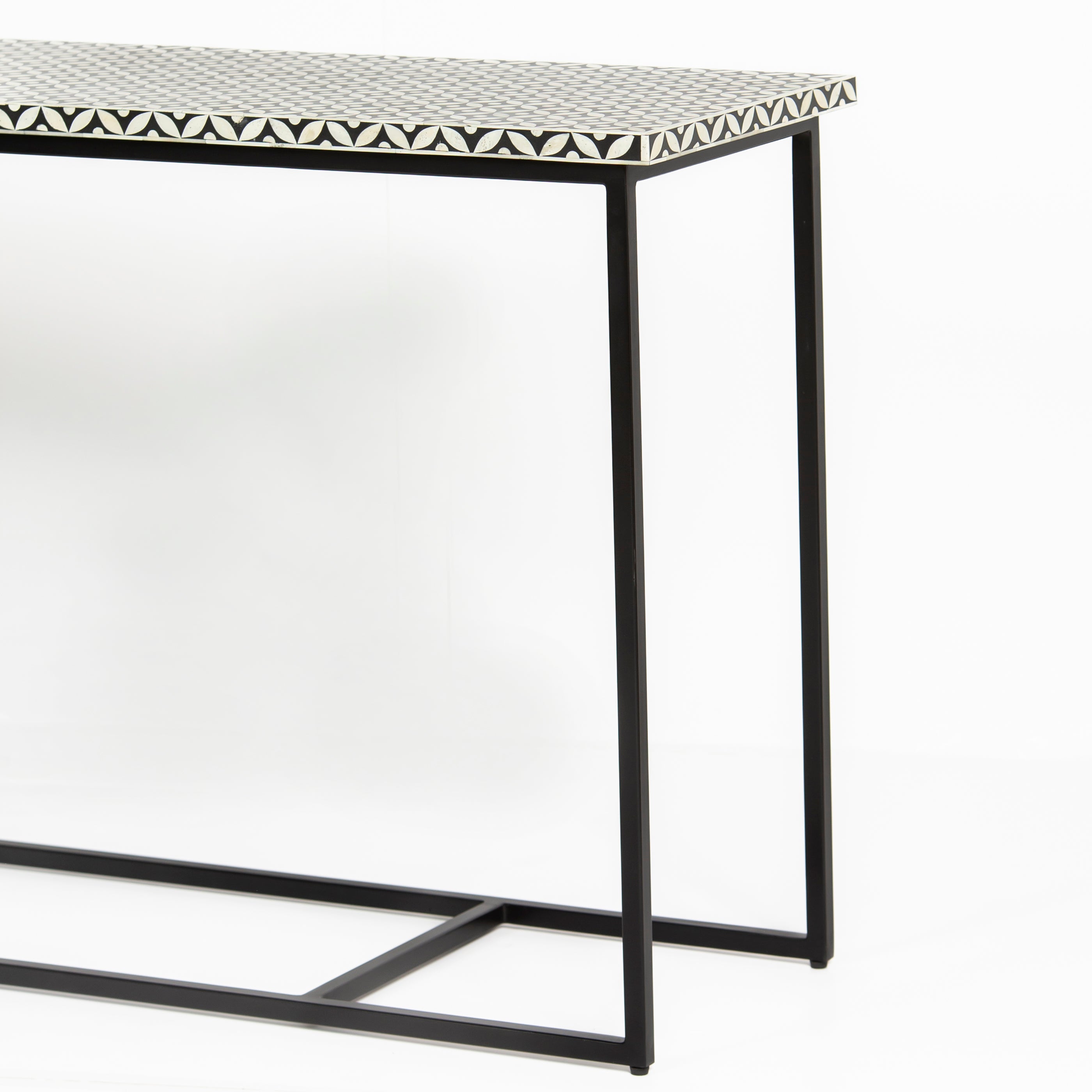 Bone inlay console table featuring geometric pattern in black and white with metal base, handcrafted furniture piece