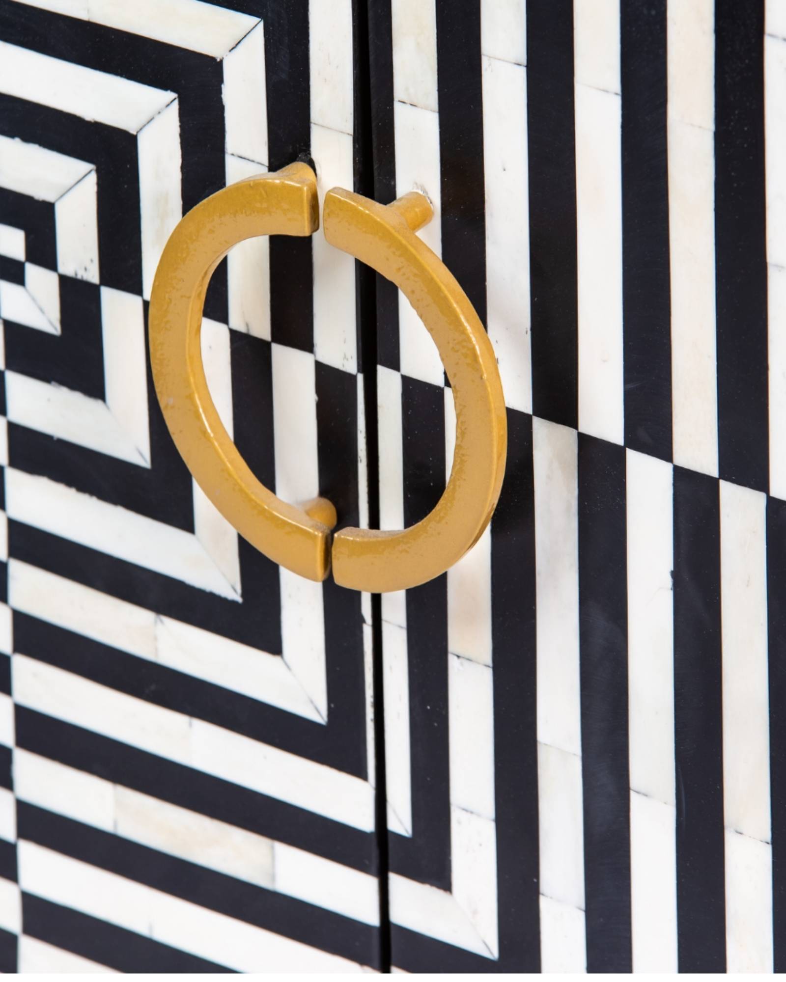 Black & White bone inlay cabinet in striped vine pattern, brass legs, and brass handles, handcrafted with spacious storage and artisanal charm.