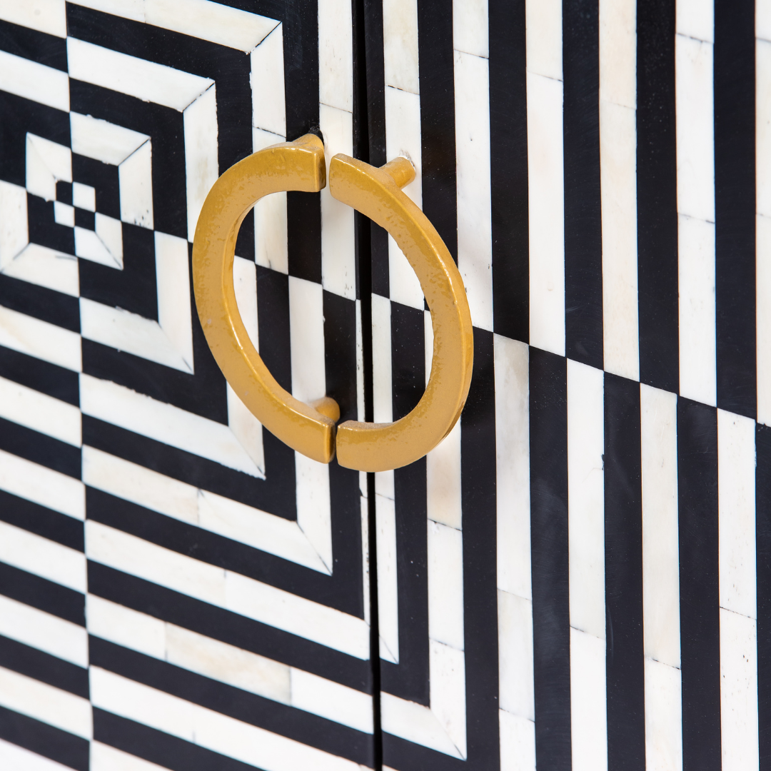Black & White bone inlay cabinet in striped vine pattern, brass legs, and brass handles, handcrafted with spacious storage and artisanal charm.