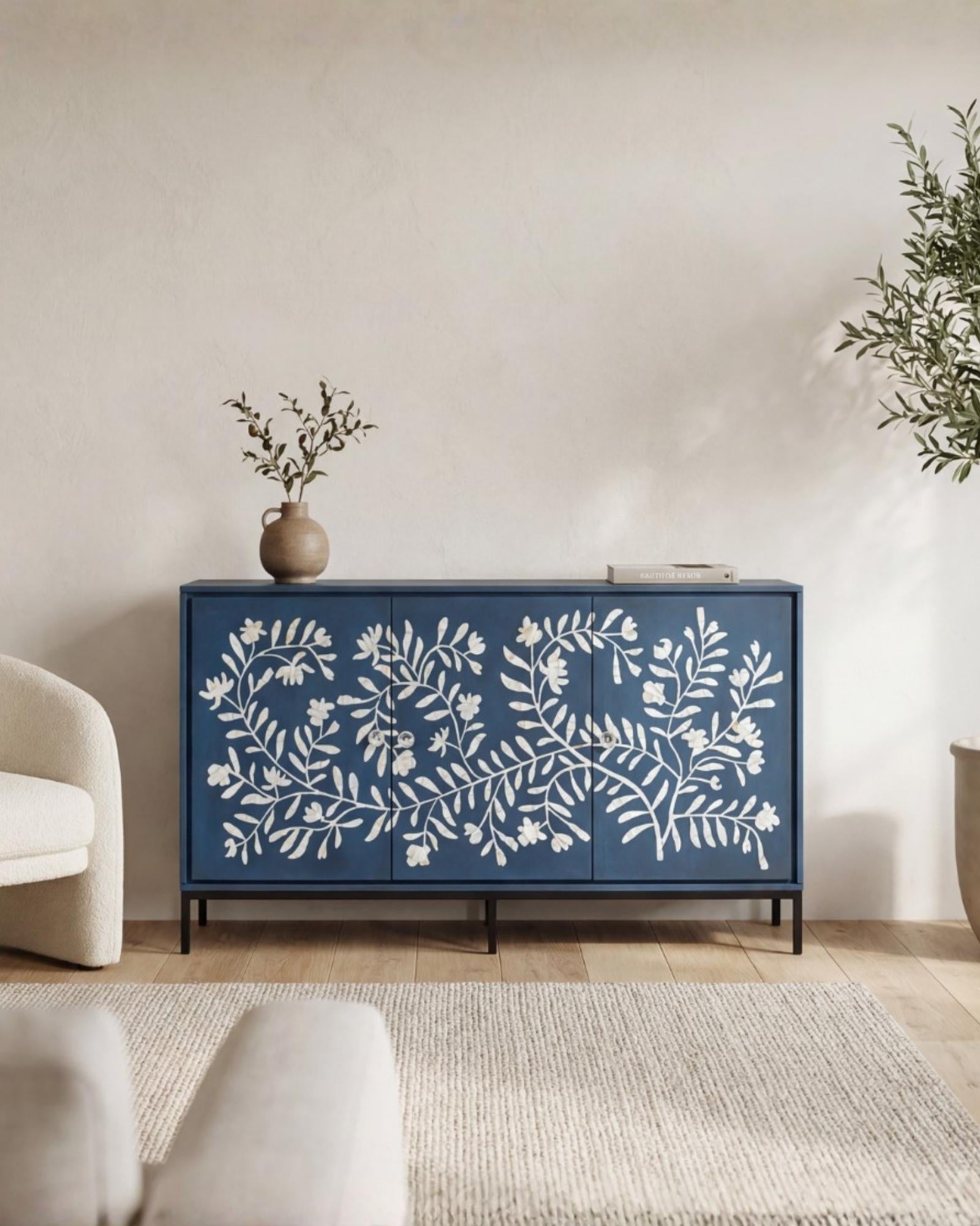 Mother of pearl inlay cabinet featuring intricate floral vine pattern in blue and white, handcrafted furniture piece.