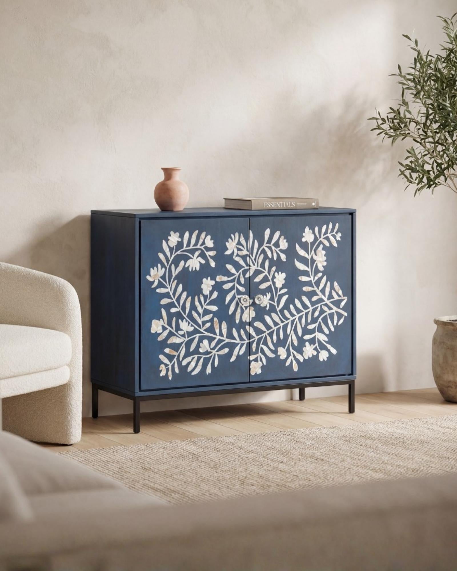 Mother of pearl inlay cabinet featuring intricate floral vine pattern in blue and white, handcrafted furniture piece.