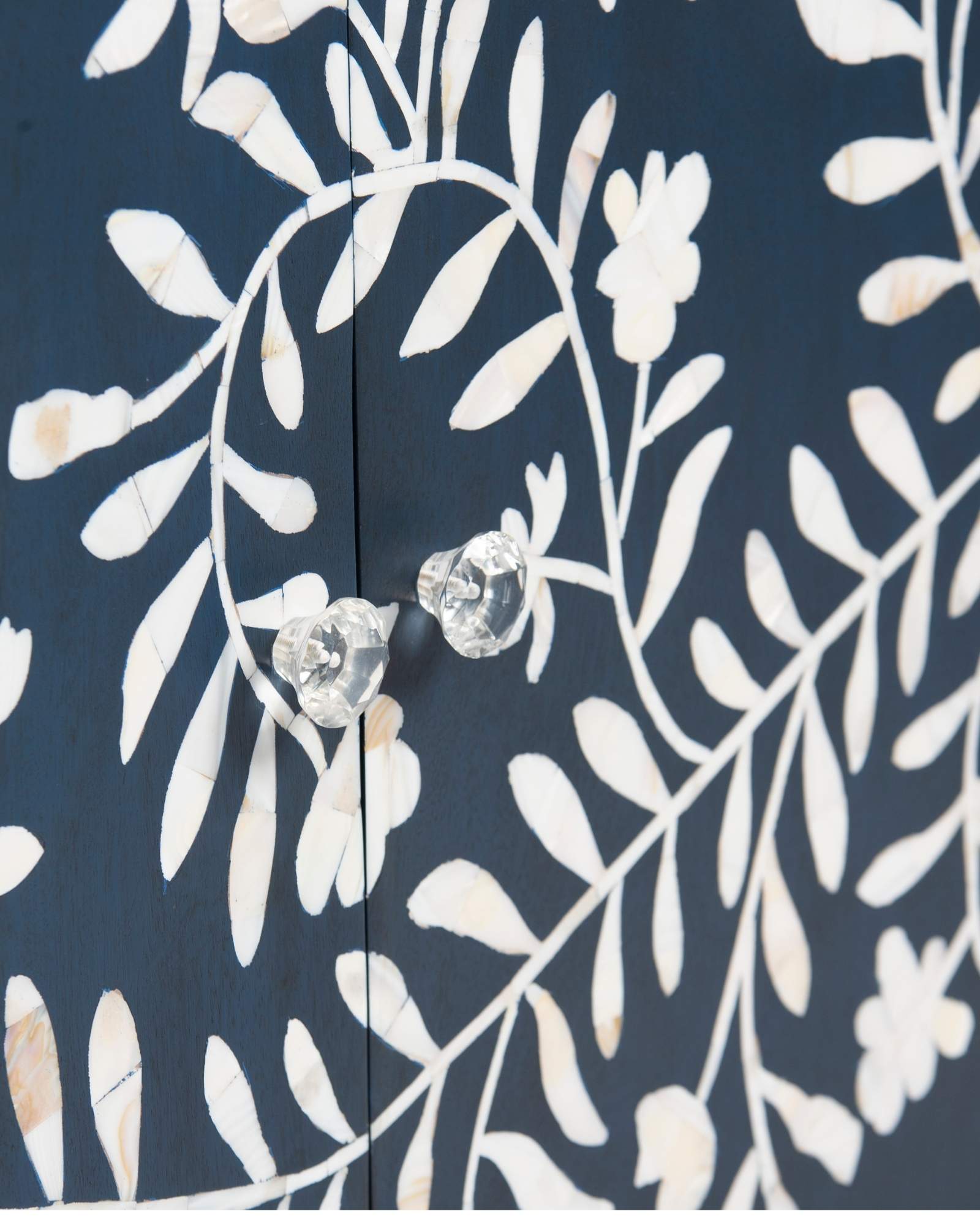 Mother of pearl inlay cabinet featuring intricate floral vine pattern in blue and white, handcrafted furniture piece.