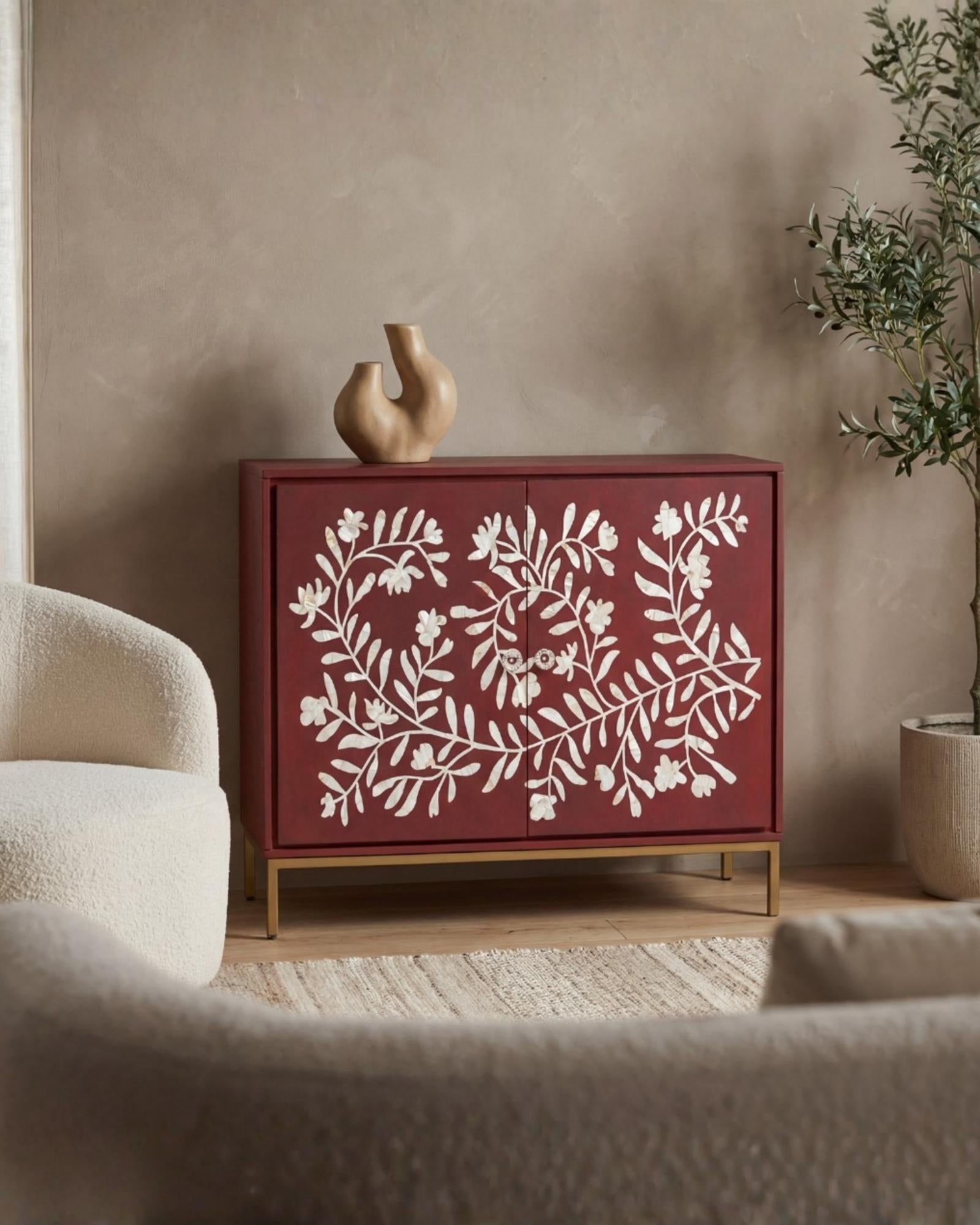 Mother of pearl inlay cabinet featuring intricate floral vine pattern in burgundy and white, handcrafted furniture piece.
