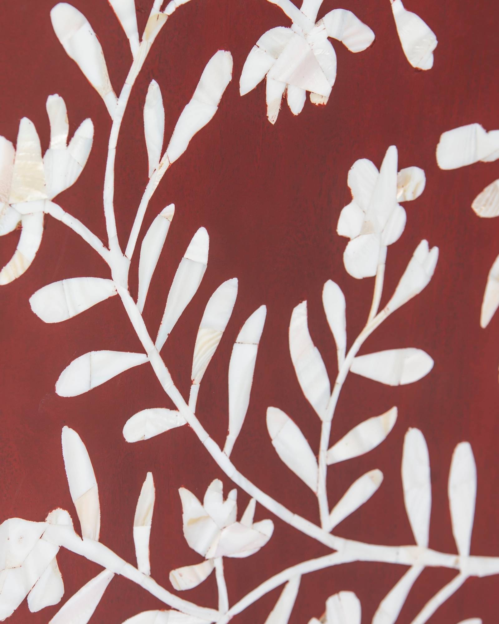 Mother of pearl inlay cabinet featuring intricate floral vine pattern in burgundy and white, handcrafted furniture piece.