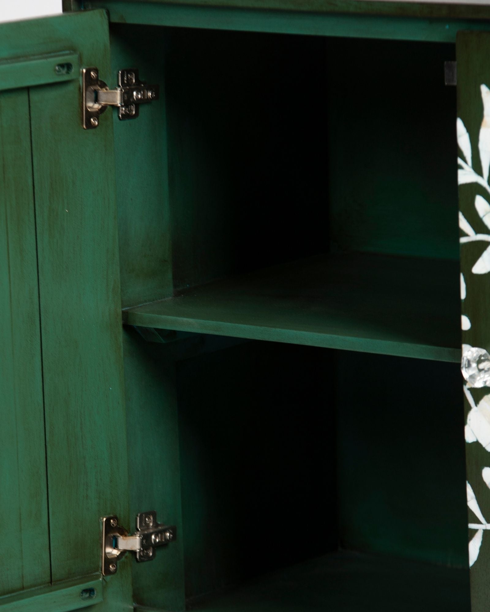 Mother of pearl inlay cabinet featuring intricate floral vine pattern in green and white, handcrafted furniture piece.