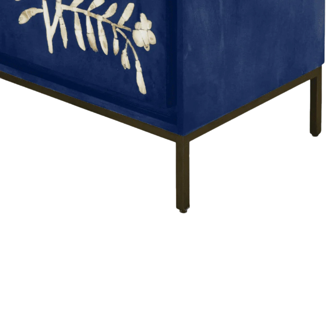 Handcrafted blue cabinet with intricate mother-of-pearl inlay, featuring a floral pattern and sleek metal legs. A luxurious storage solution for any space.
