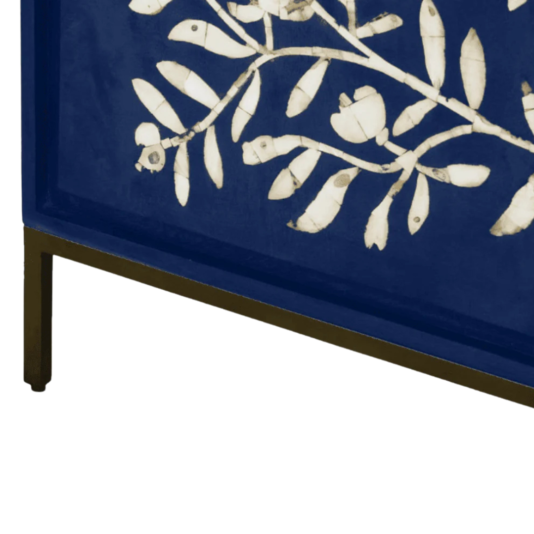Handcrafted blue cabinet with intricate mother-of-pearl inlay, featuring a floral pattern and sleek metal legs. A luxurious storage solution for any space.
