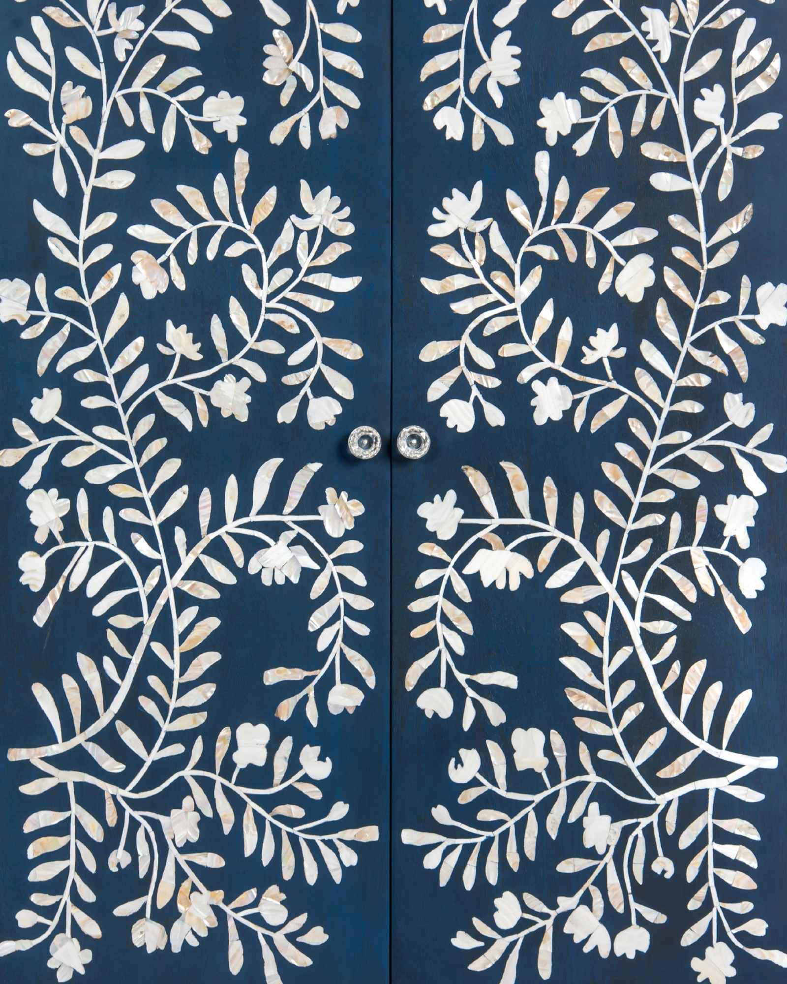 Mother of pearl inlay cabinet featuring intricate floral vine pattern in blue and white, handcrafted furniture piece.