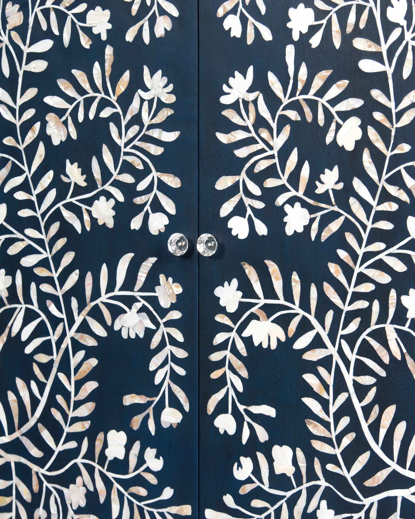 Mother of pearl inlay cabinet featuring intricate floral vine pattern in blue and white, handcrafted furniture piece.