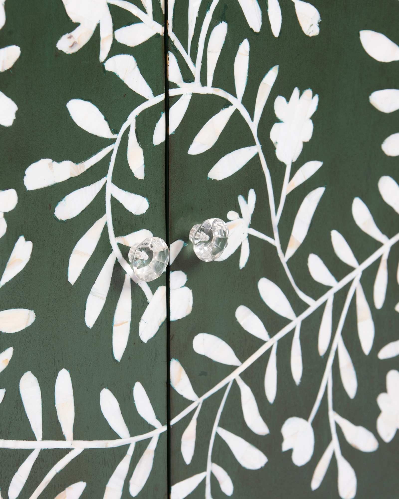 Mother of pearl inlay cabinet featuring intricate floral vine pattern in green and white, handcrafted furniture piece.